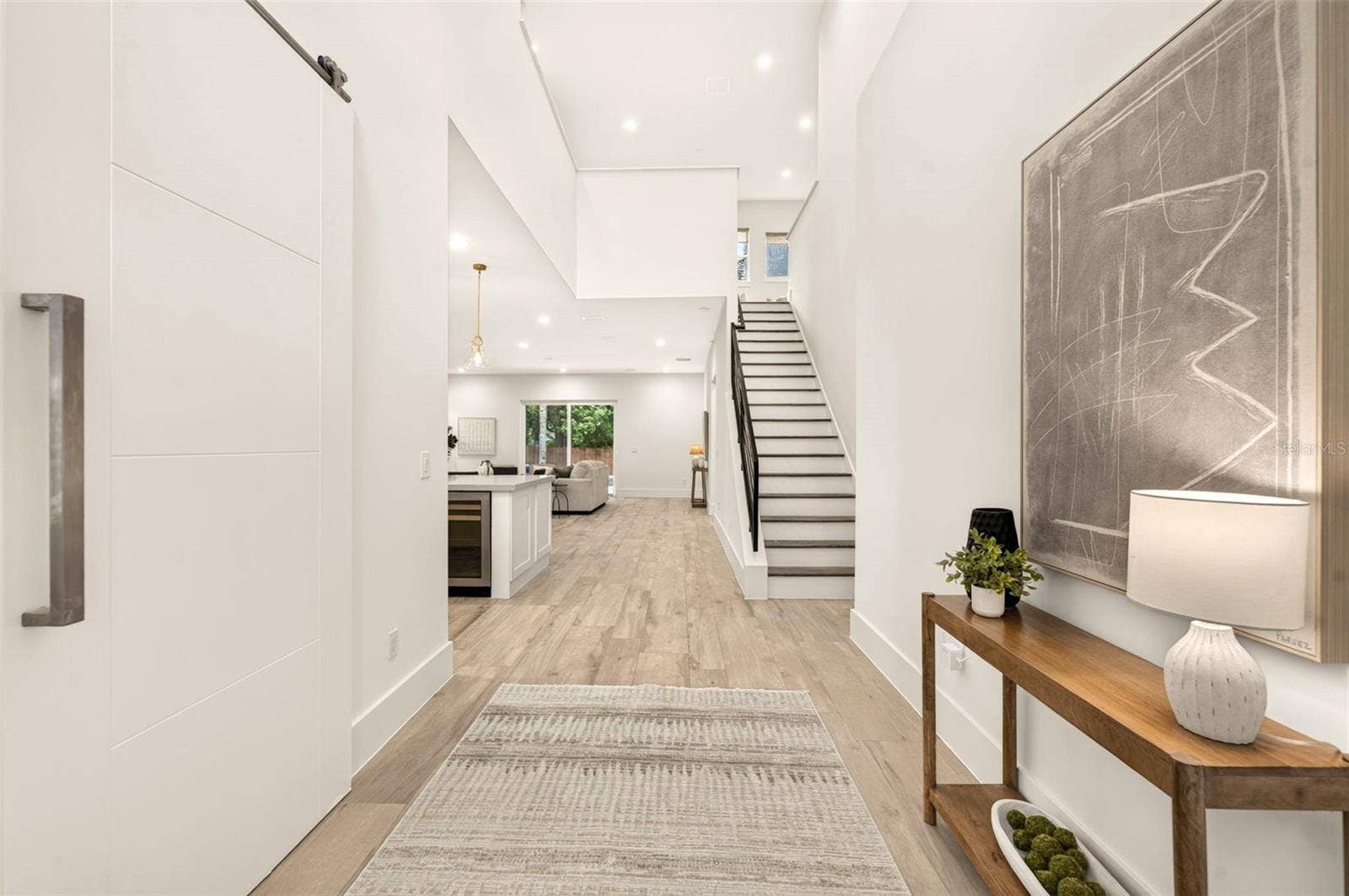 Foyer/entrance greets with 20-ft ceilings