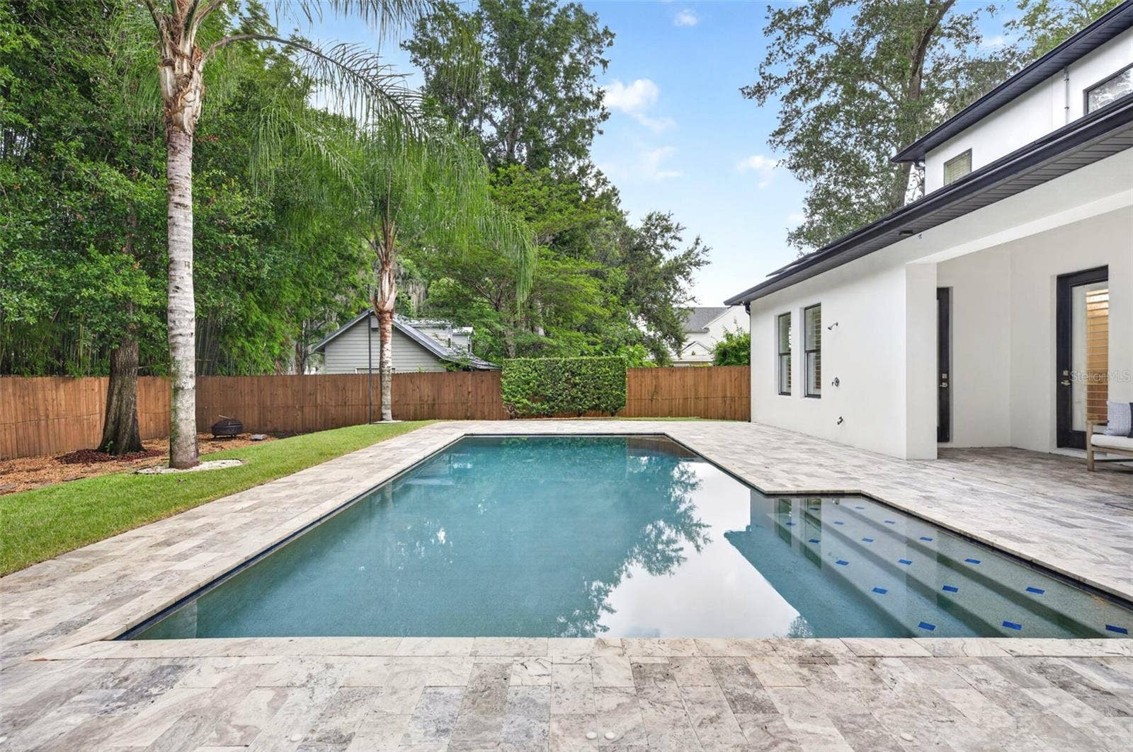 Private backyard with space for pets, lounging, & play