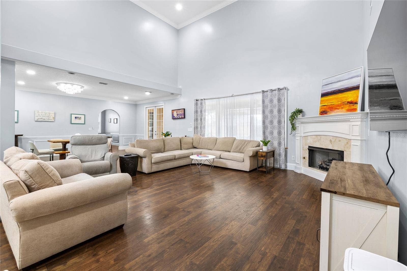 12901 PHILLIPS ROAD, Groveland, FL 34736 Living room 20' ceilings and fireplace