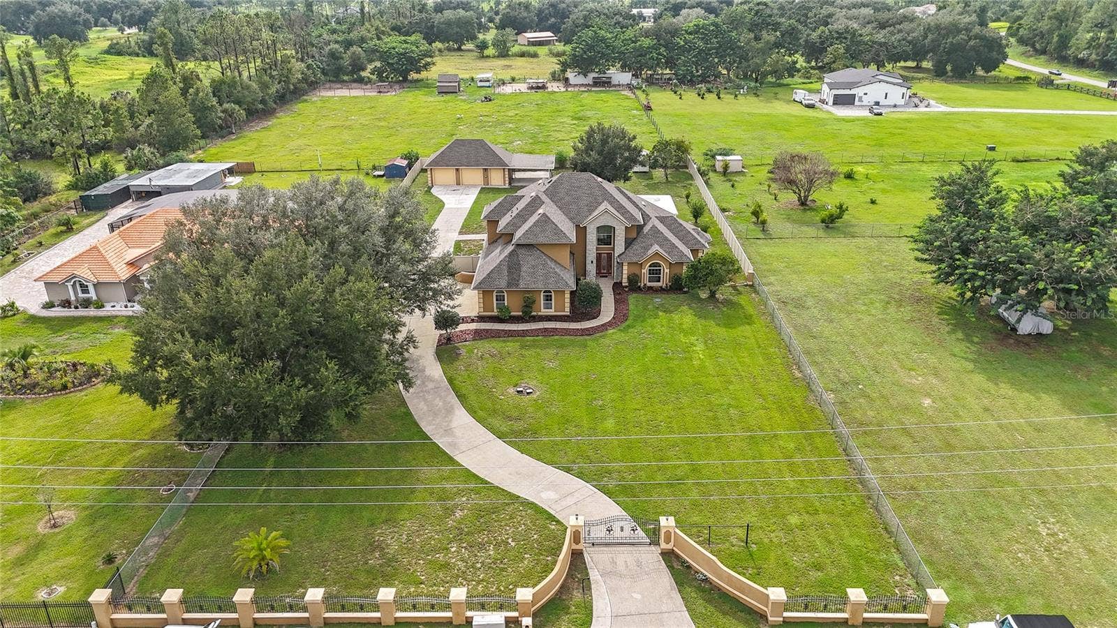 12901 PHILLIPS ROAD, Groveland, FL 34736 Private electronic gate and fully fenced