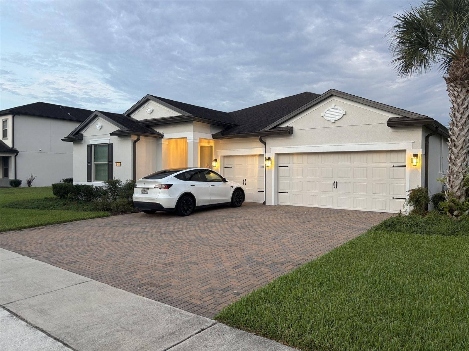 14048 LARKSPUR LAKE DRIVE, Winter Garden, FL 34787 14048 Larkspur Lake Dr - Front exterior view featuring the three-car garage and expansive driveway can fit 6 vehicles in the driveway.