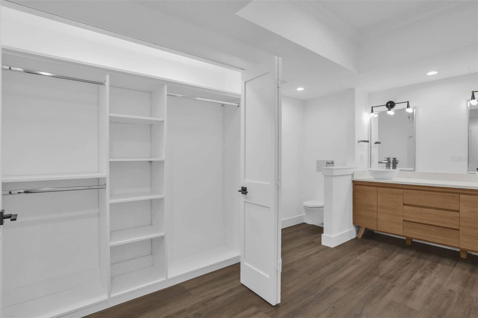 7593 GATHERING DRIVE, #707, Reunion, FL 34747 Primary Bath with Two Custom Closets with Built-ins