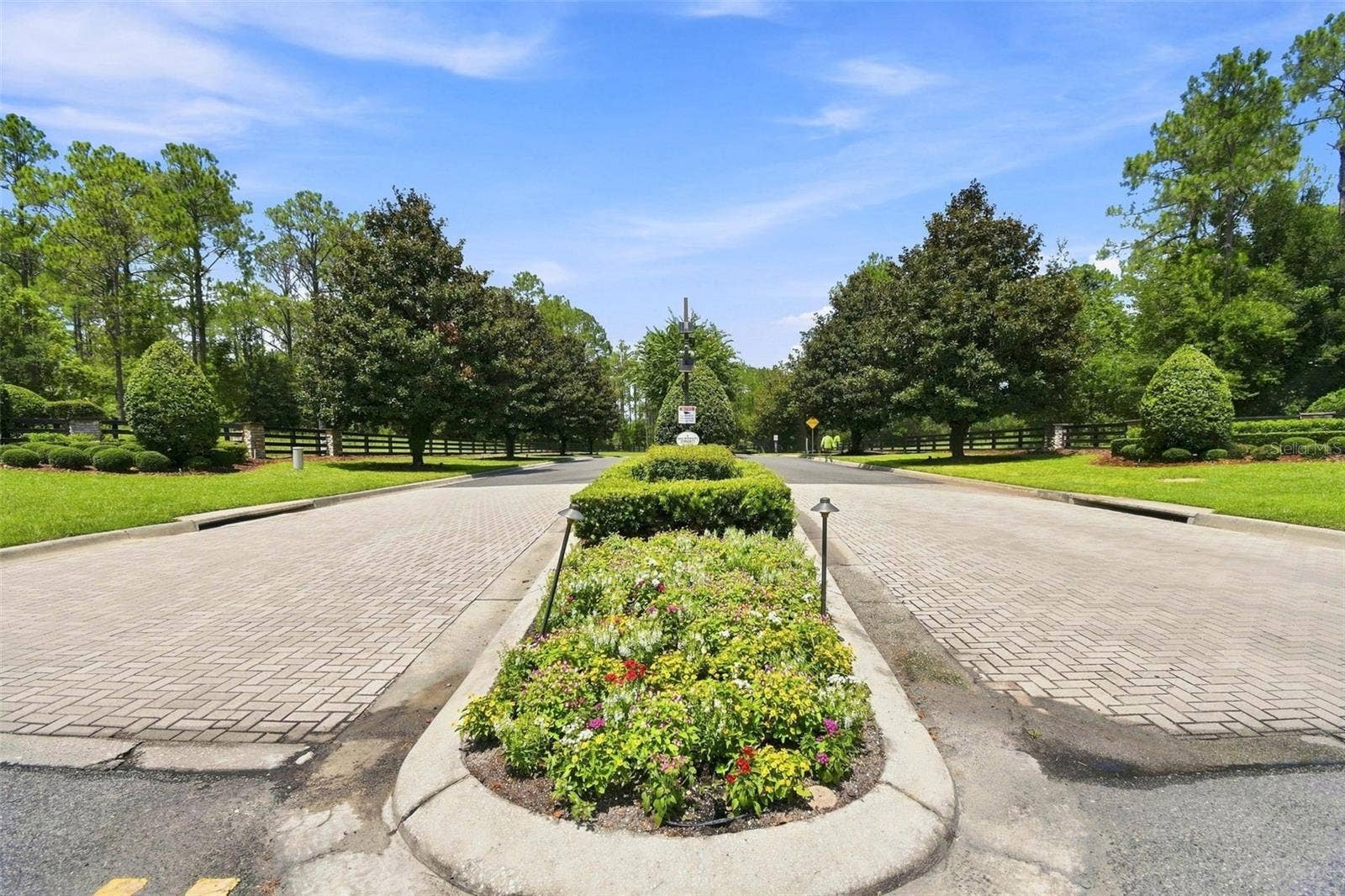 24150 GREENWOOD CROSSING, Eustis, FL 32736 Community entrance with paver bricks