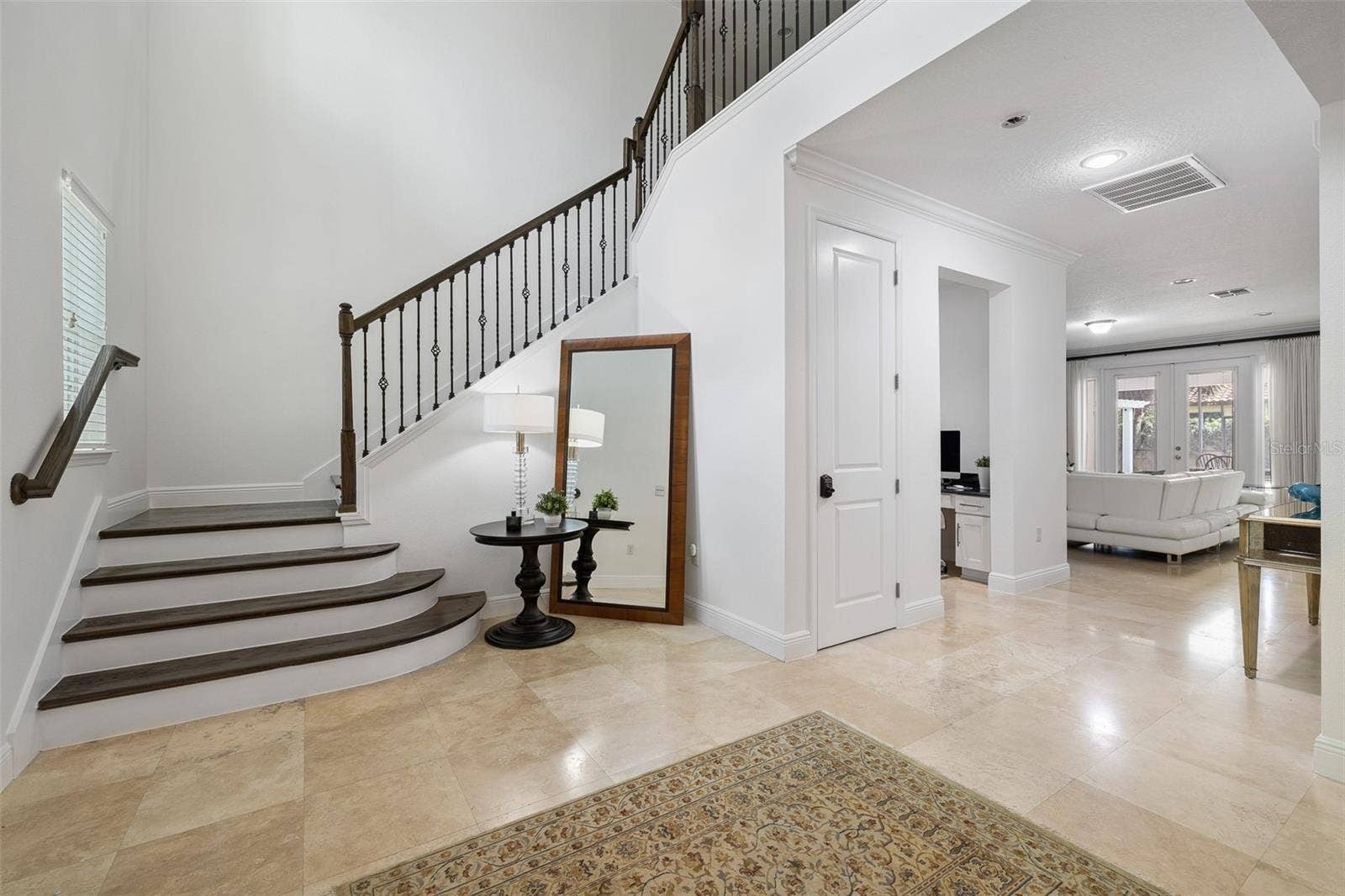 Travertine floor, wooden staircase