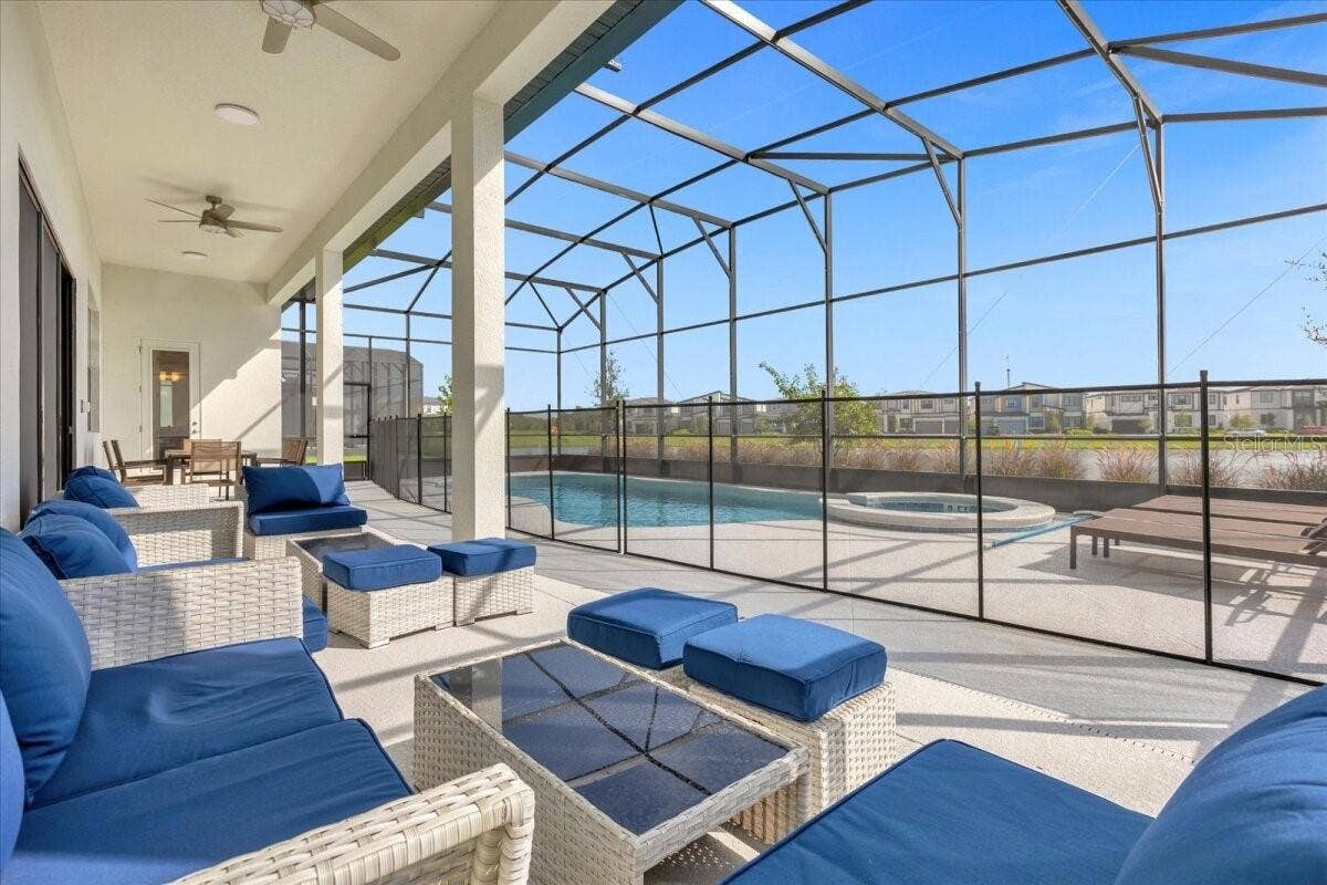 5830 HIGH SEAS DRIVE, Orlando, FL 32821 Conversation area - covered lanai