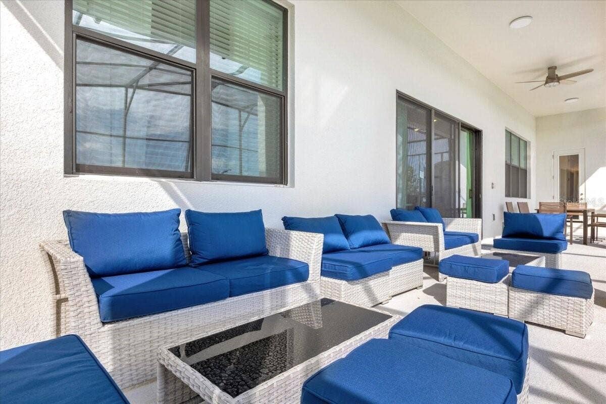5830 HIGH SEAS DRIVE, Orlando, FL 32821 Conversation area - covered lanai