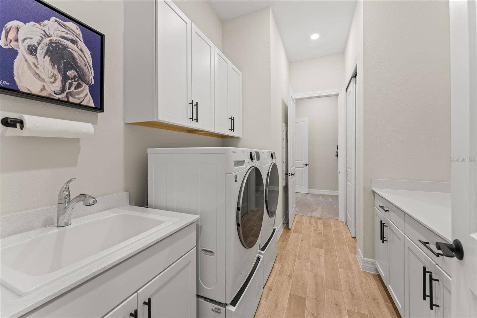 3292 WINDBEAM COURT, Winter Garden, FL 34787 Upgraded laundry with cabinets, countertops and sink.