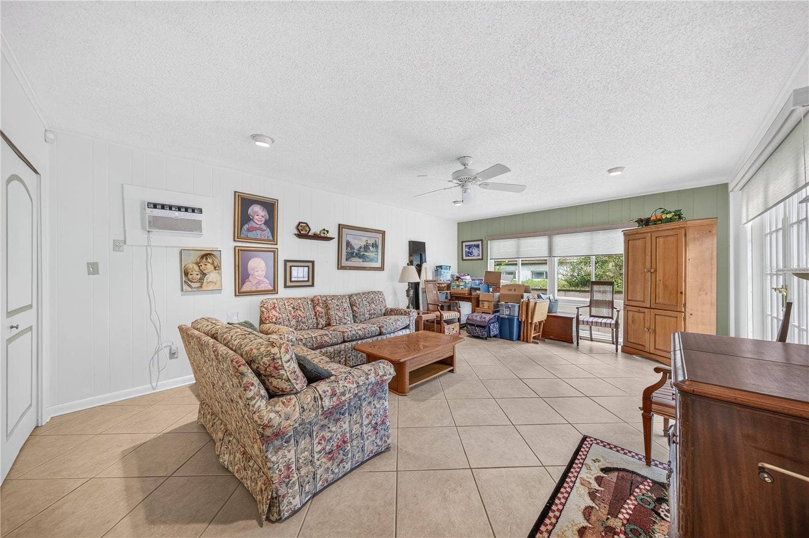 Family room with a pool view.