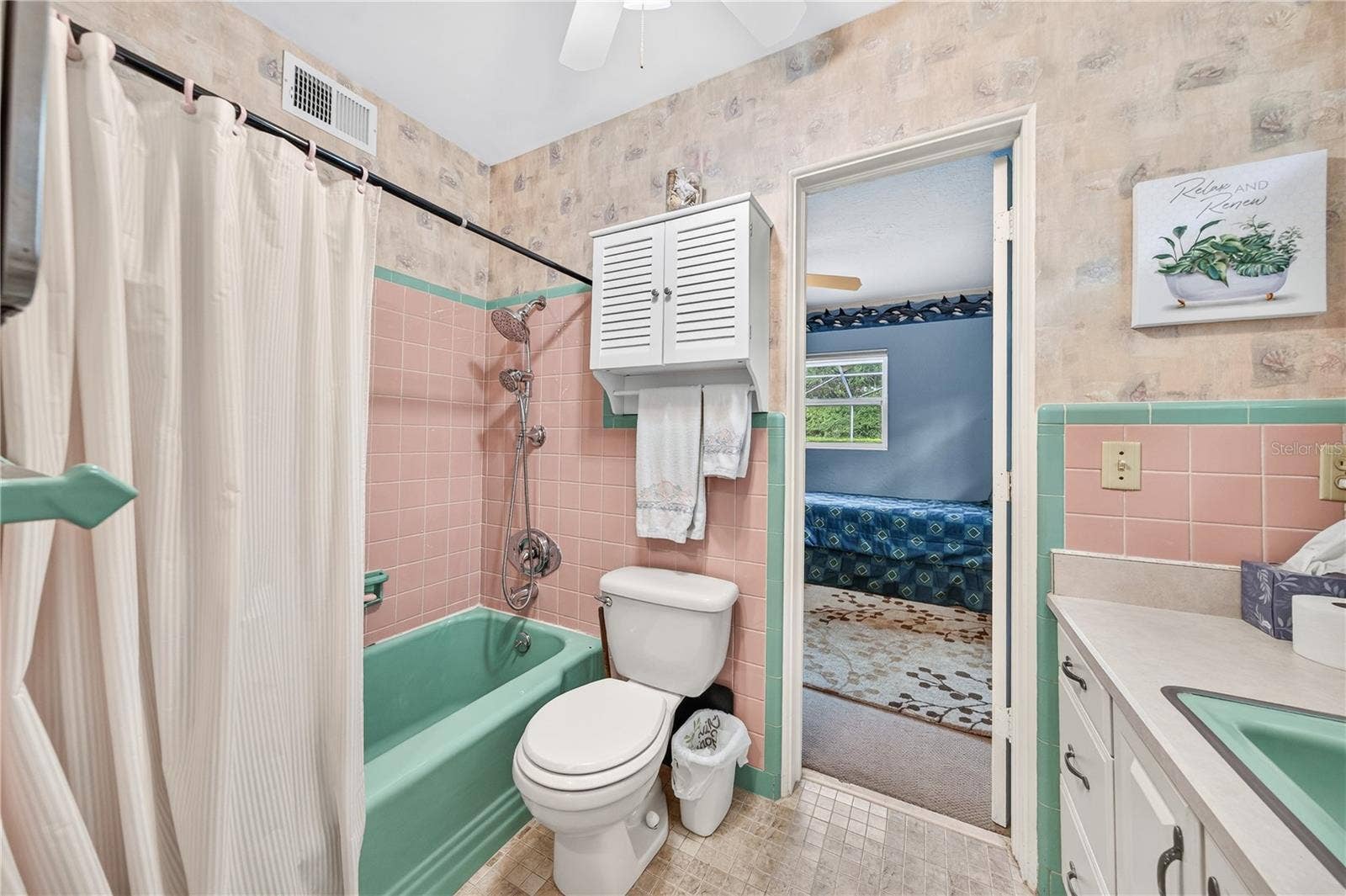 Full bath shared with Primary and bedroom #2.