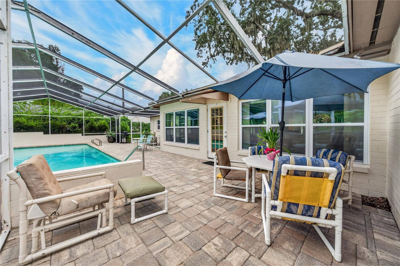 Pool deck with pavers.