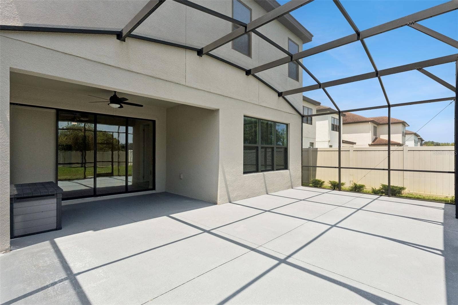 Screened Outdoor Living  Spacious screened patio offers a generous covered area with direct access to the interior and plenty of room for outdoor seating and dining.