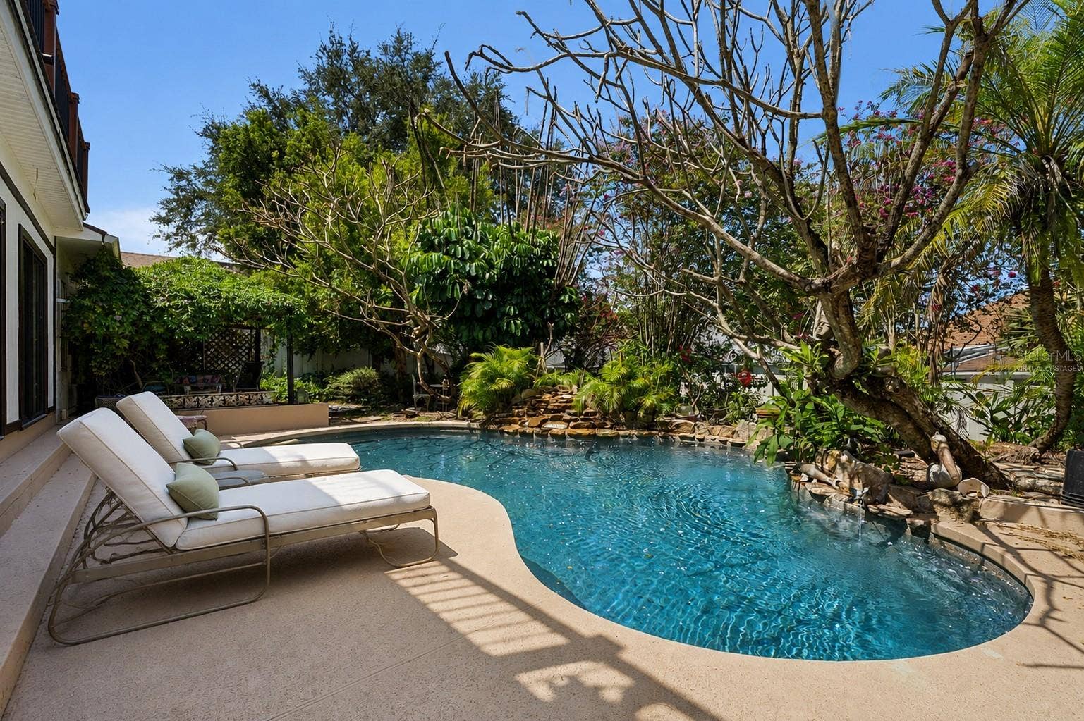Virtually Staged. Private Oasis in your backyard. Naturally covered patio adjacent to pool area.