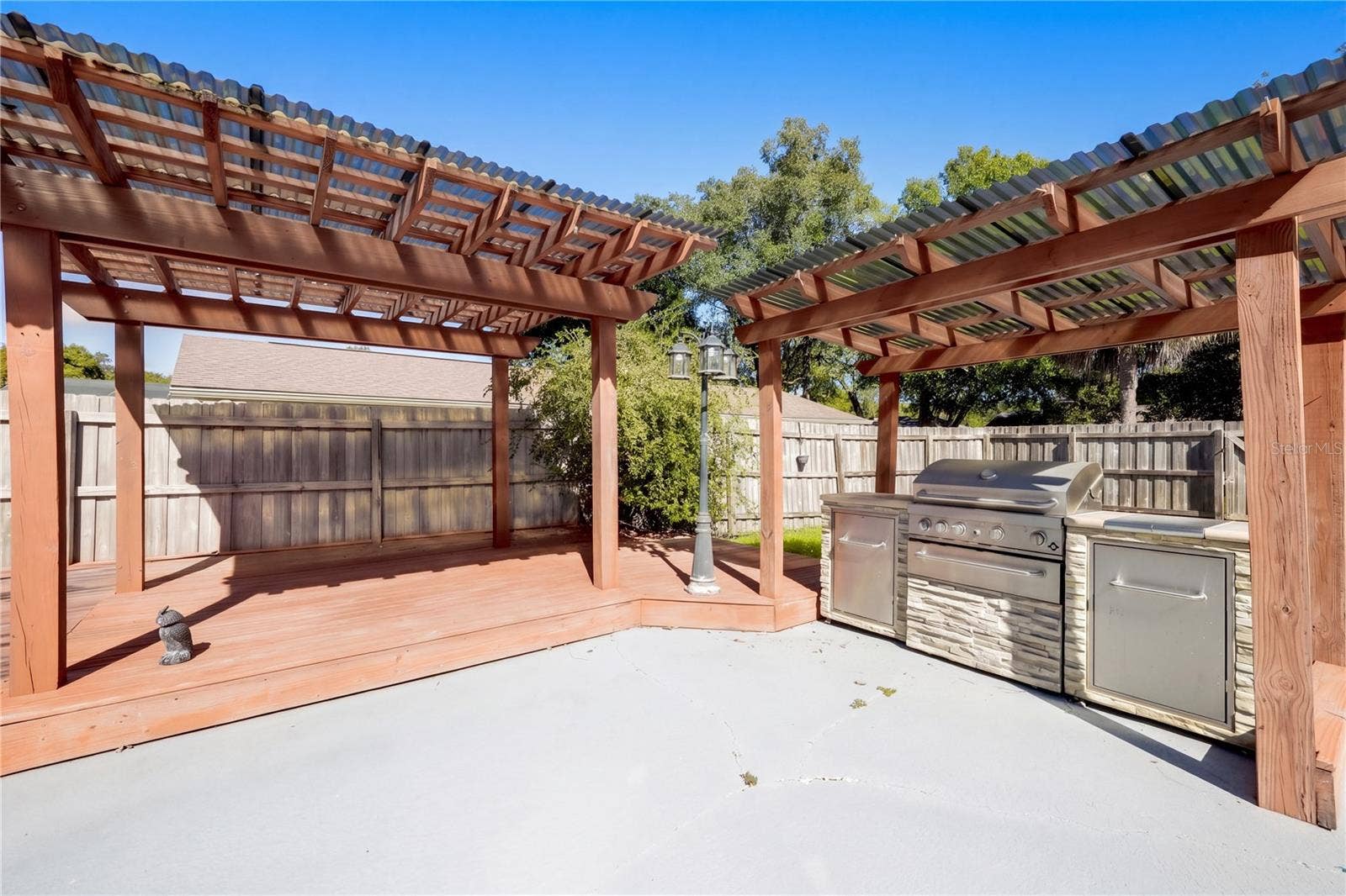 954 NIBLICK DRIVE, Casselberry, FL 32707 Outdoor pergola and grilling area