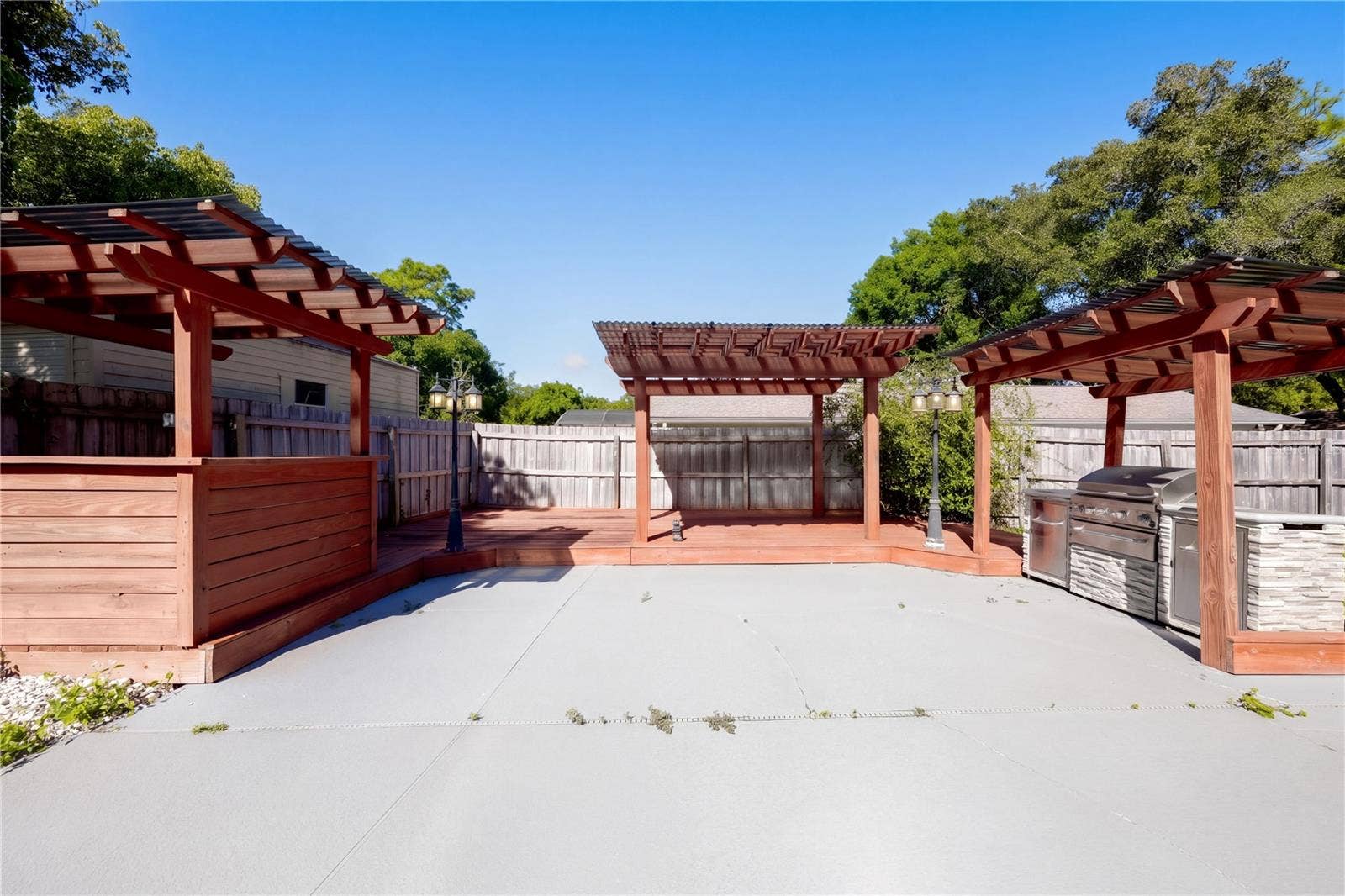 954 NIBLICK DRIVE, Casselberry, FL 32707 Outdoor pergola and grilling area