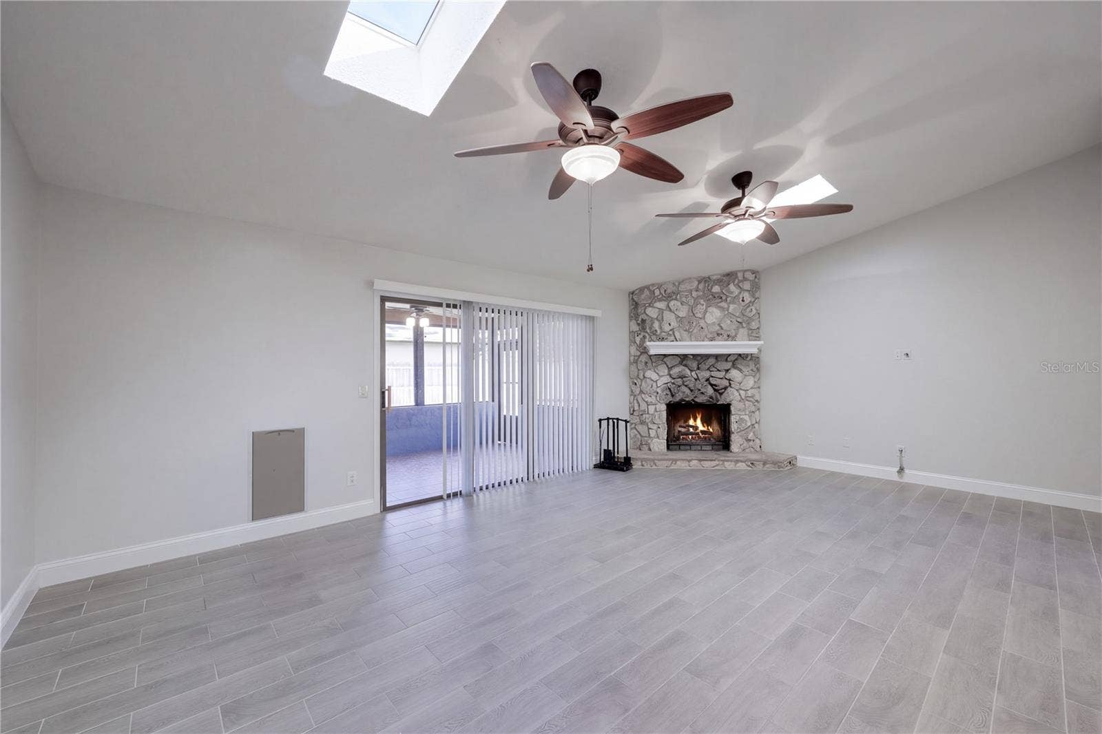 954 NIBLICK DRIVE, Casselberry, FL 32707 Family Room with woodburning fireplace