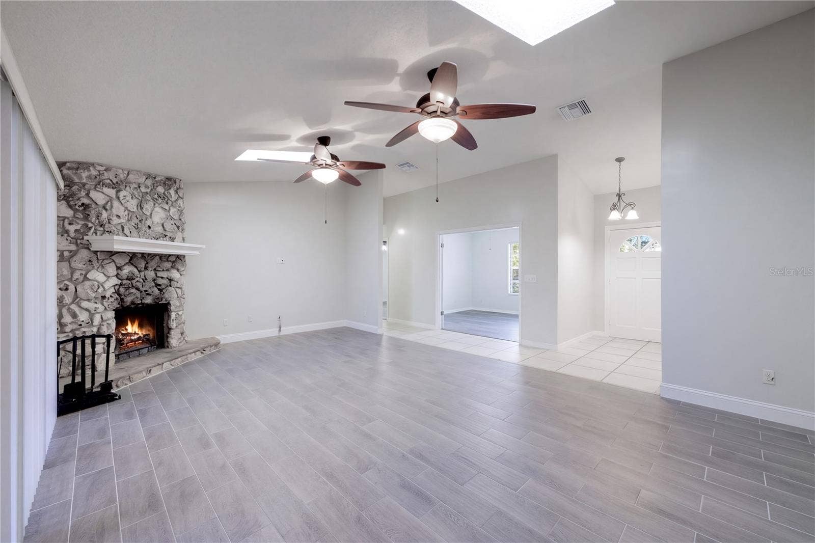 954 NIBLICK DRIVE, Casselberry, FL 32707 Family Room with woodburning fireplace