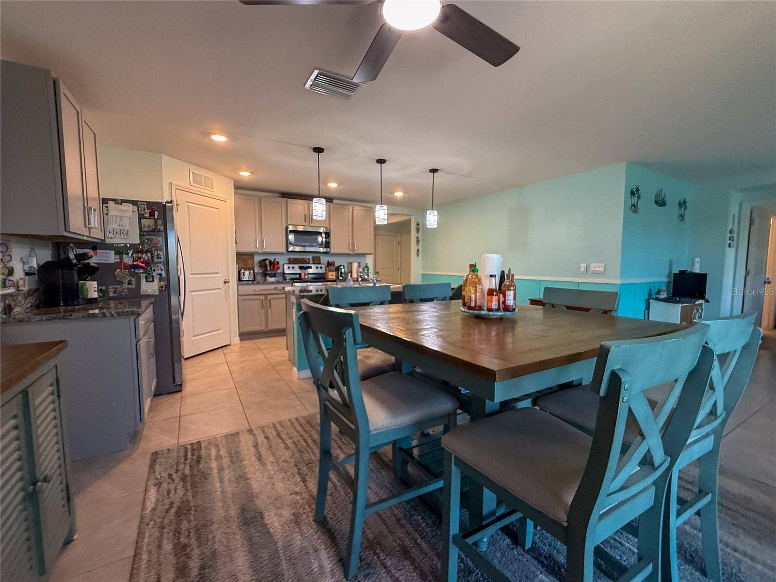 4120 QUIET RAIN COURT, Palmetto, FL 34221 DINING ROOM WITH KITCHEN VIEW
