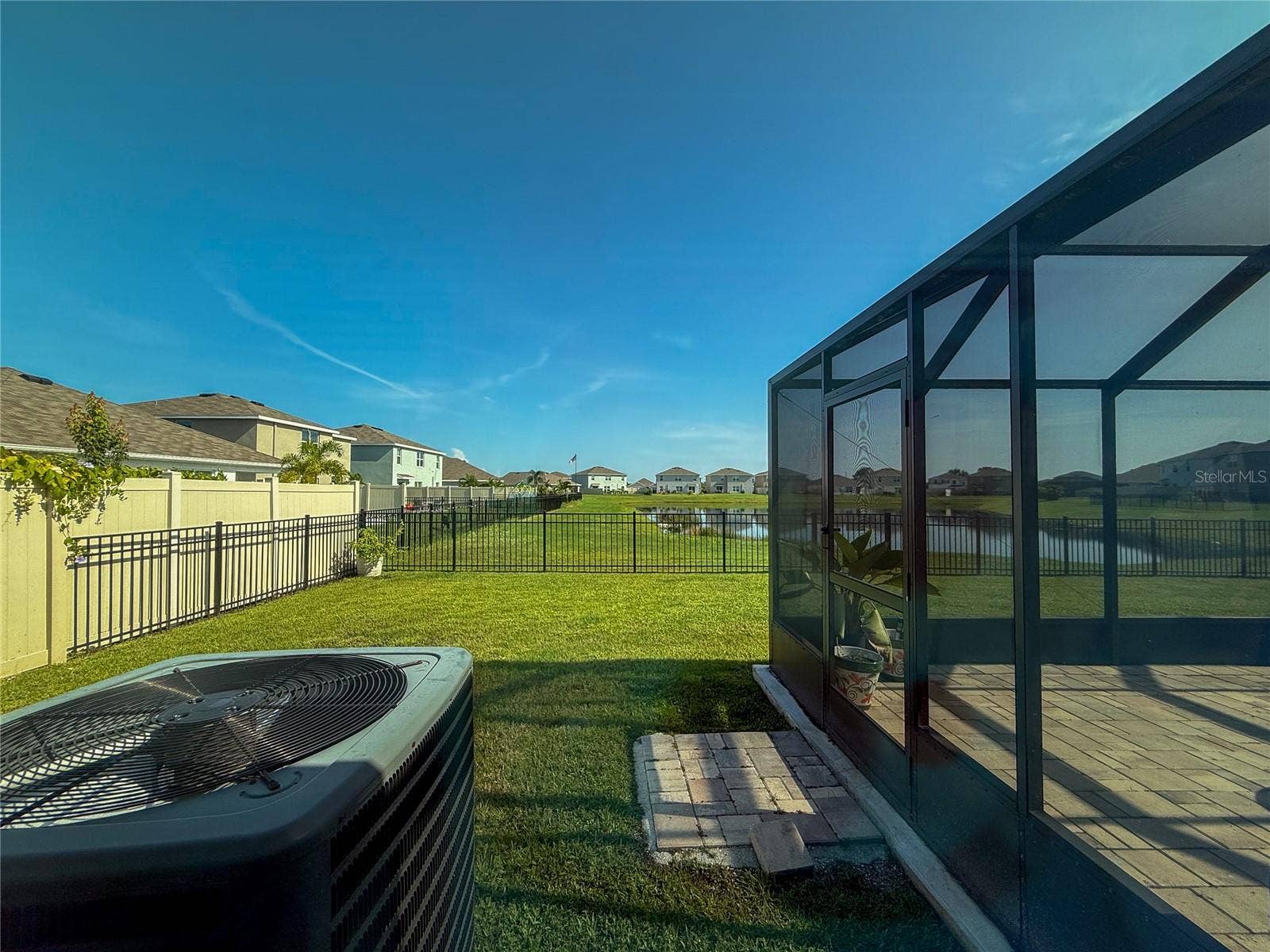 4120 QUIET RAIN COURT, Palmetto, FL 34221 VIEW OF BACKYARD AND POND FROM PRIMARY BEDROOM