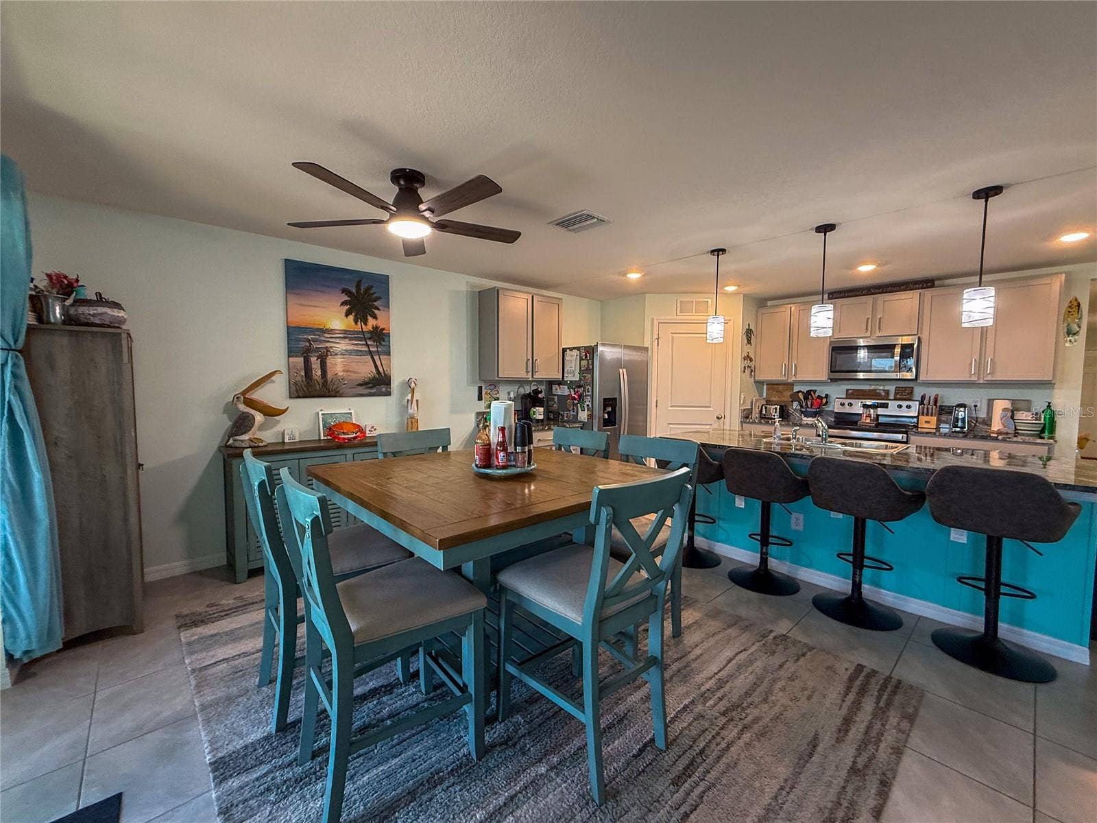 4120 QUIET RAIN COURT, Palmetto, FL 34221 DINING ROOM WITH KITCHEN VIEW