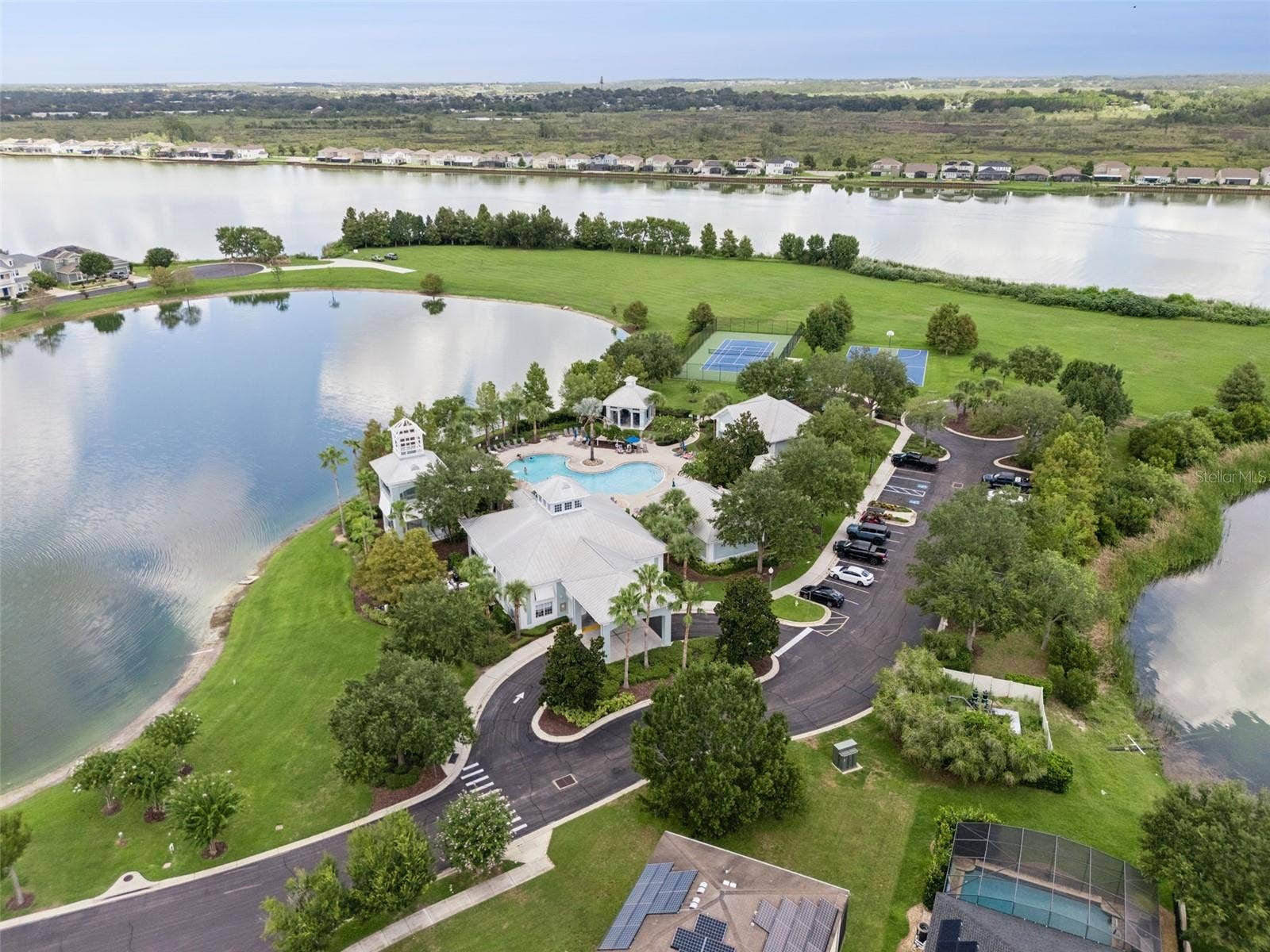 589 BLUE CYPRESS DRIVE, Groveland, FL 34736 Clubhouse, Pool, Gym, Tennis, Pickle ball, and Playground amenities.