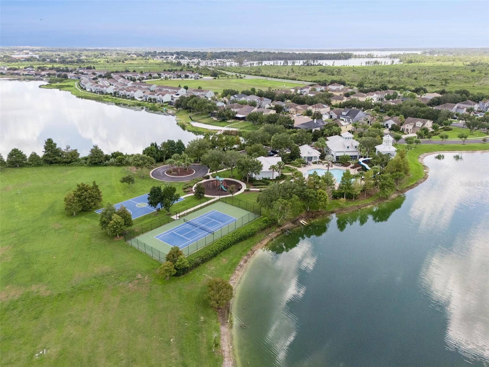 589 BLUE CYPRESS DRIVE, Groveland, FL 34736 Clubhouse, Pool, Gym, Tennis, Pickle ball, and Playground amenities.