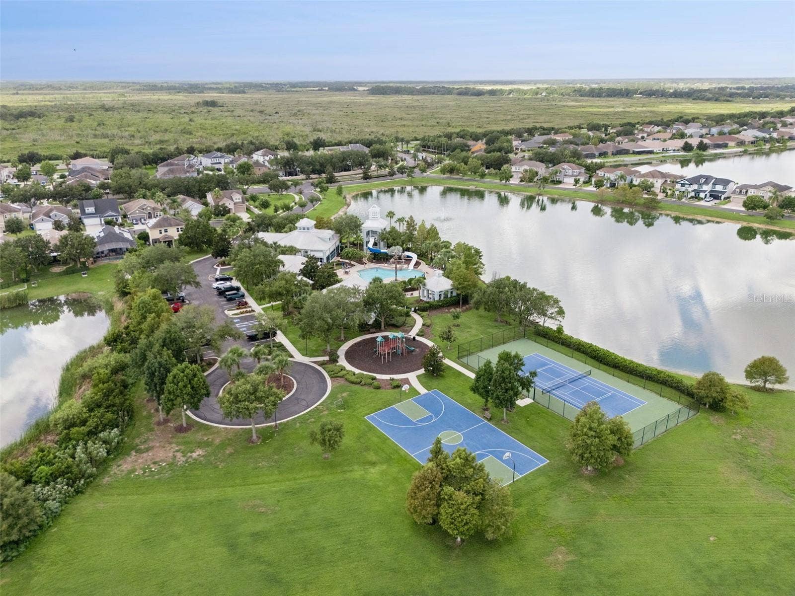 589 BLUE CYPRESS DRIVE, Groveland, FL 34736 Clubhouse, Pool, Gym, Tennis, Pickle ball, and Playground amenities.
