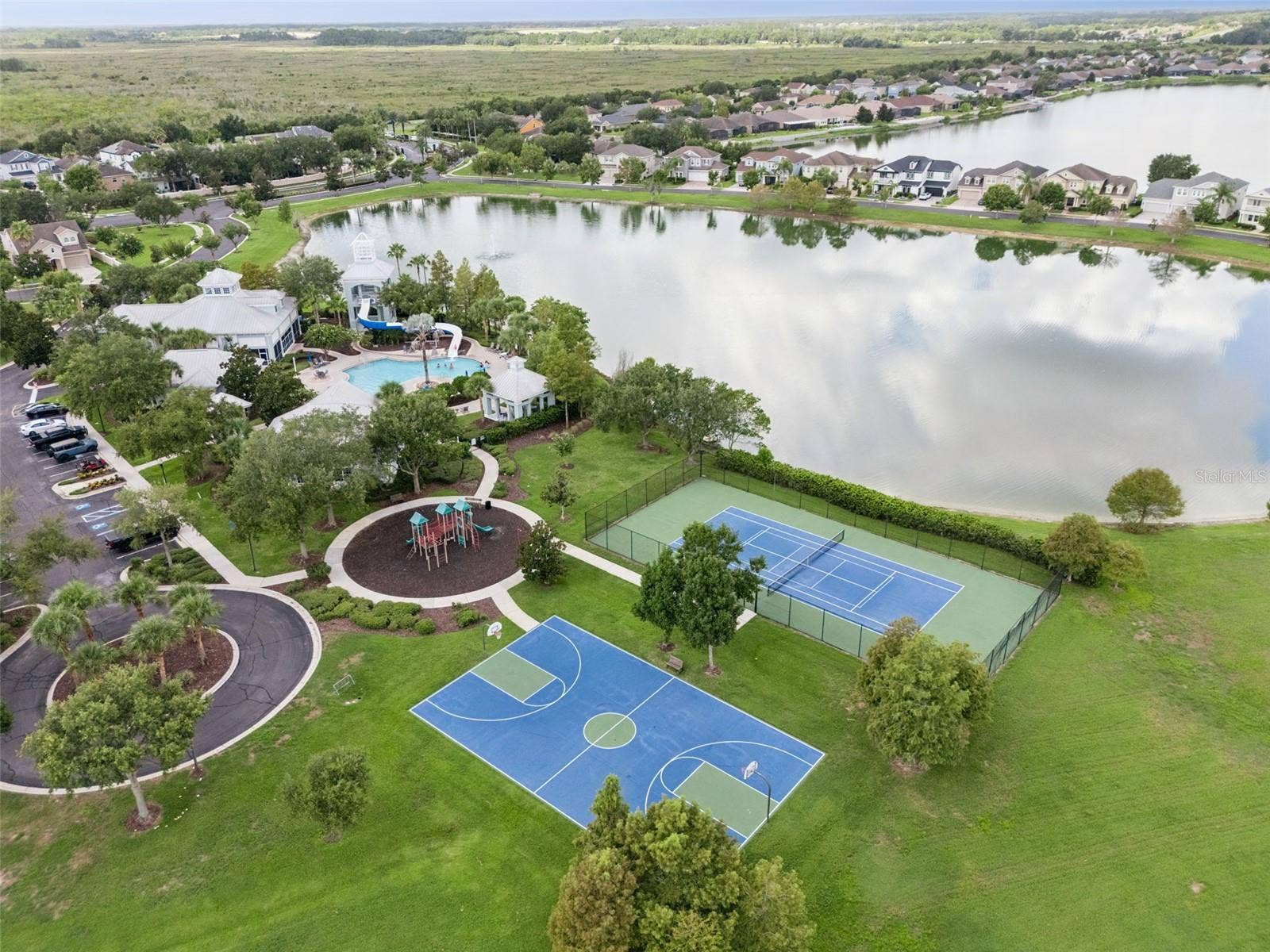 589 BLUE CYPRESS DRIVE, Groveland, FL 34736 Clubhouse, Pool, Gym, Tennis, Pickle ball, and Playground amenities.
