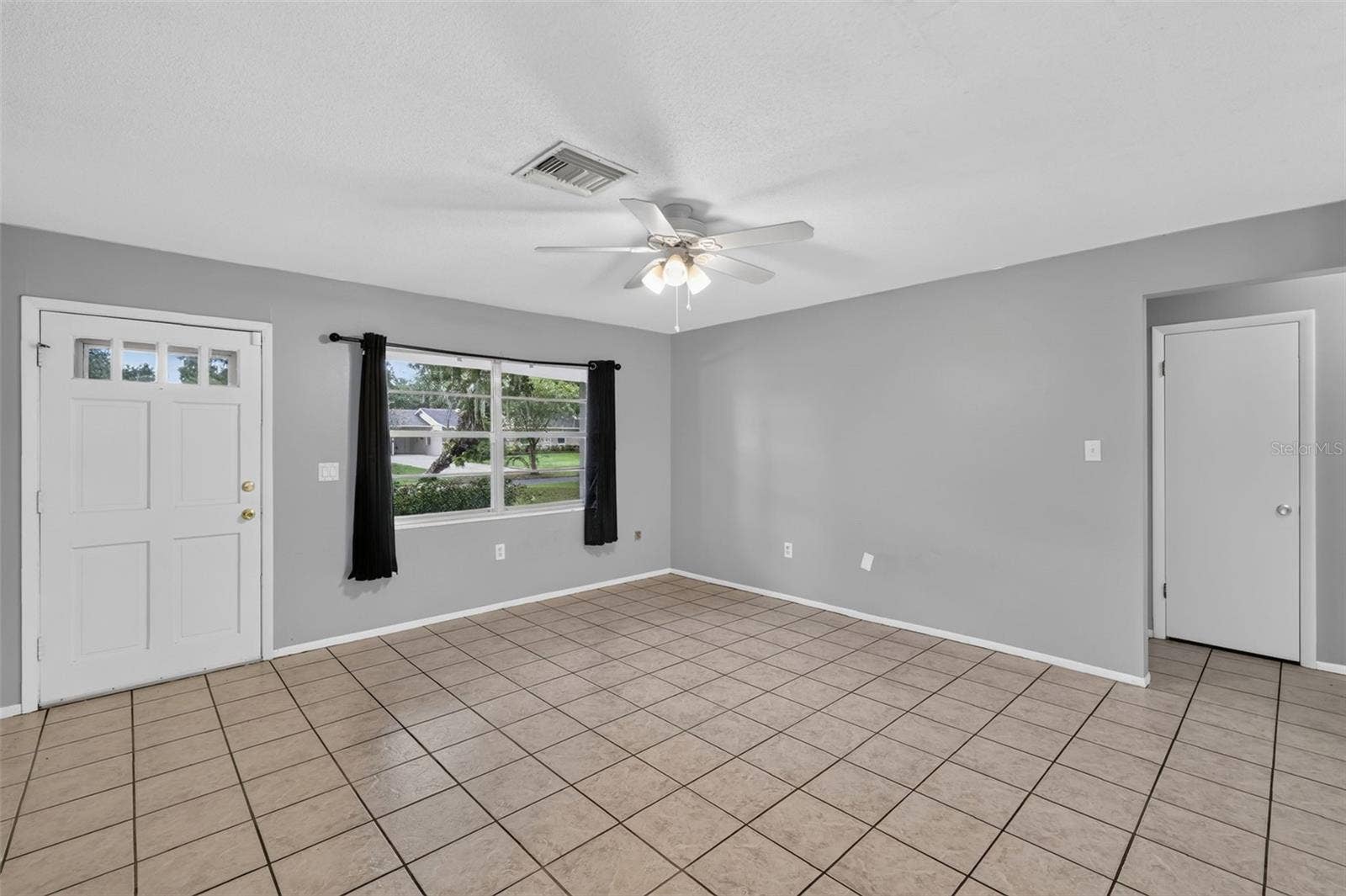1305 ORANGE AVENUE, Tavares, FL 32778 Another View of the Main Living area with Abundant Natural Light