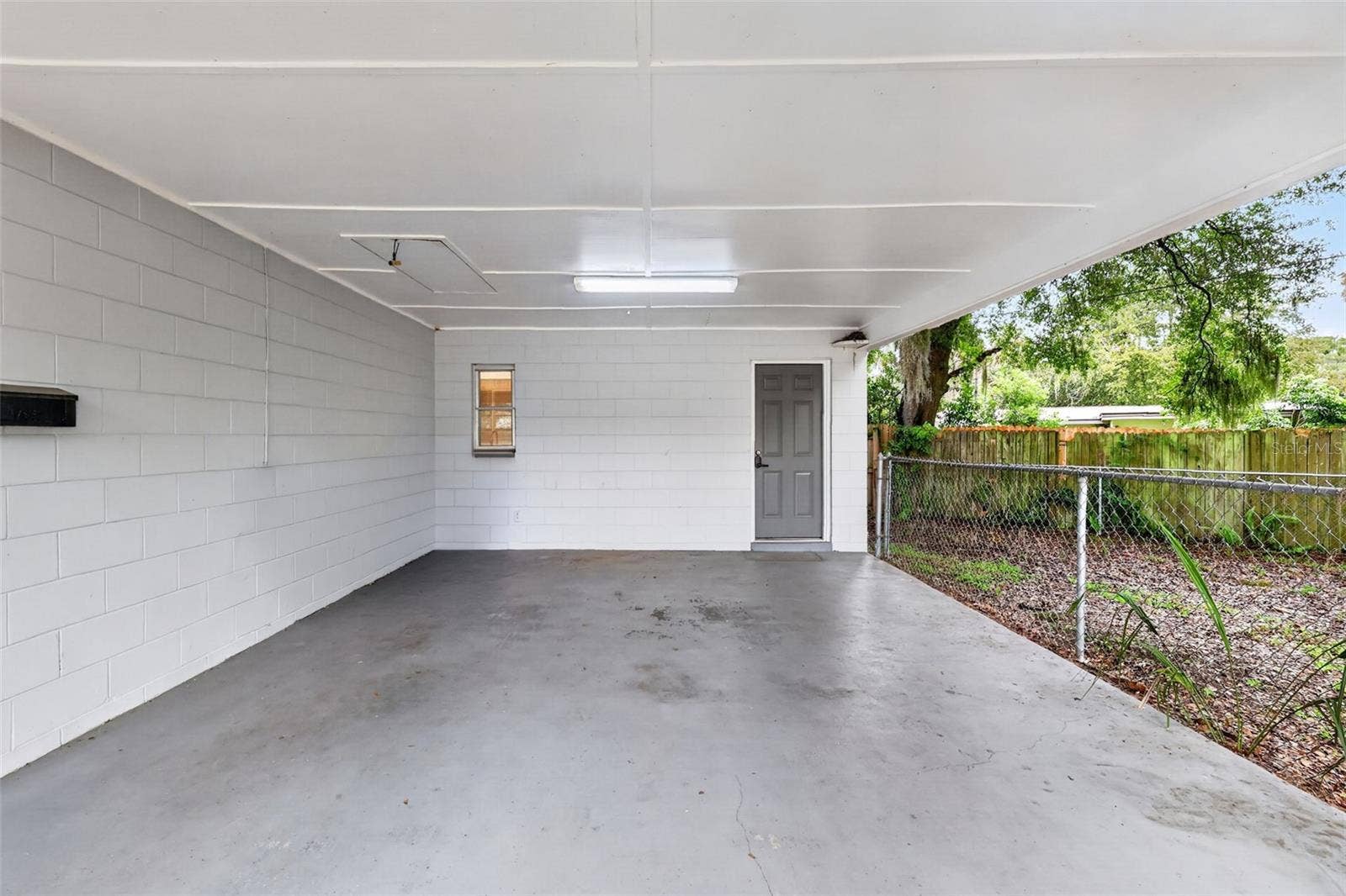 1305 ORANGE AVENUE, Tavares, FL 32778 Nice Covered Carport With Convenient Side Entry To The Home