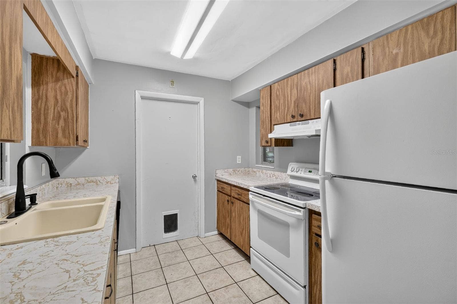 1305 ORANGE AVENUE, Tavares, FL 32778 Functional Kitchen Layout with Room To Make It Your Own