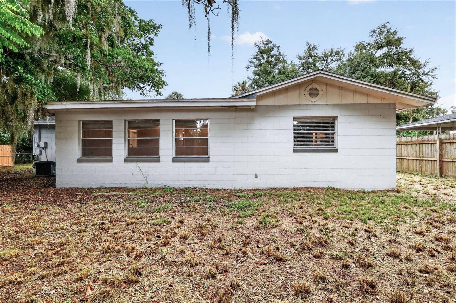 1305 ORANGE AVENUE, Tavares, FL 32778 Fully Fenced Back Yard With Room for Pets, Gardening, and Simple Outdoor Enjoyment