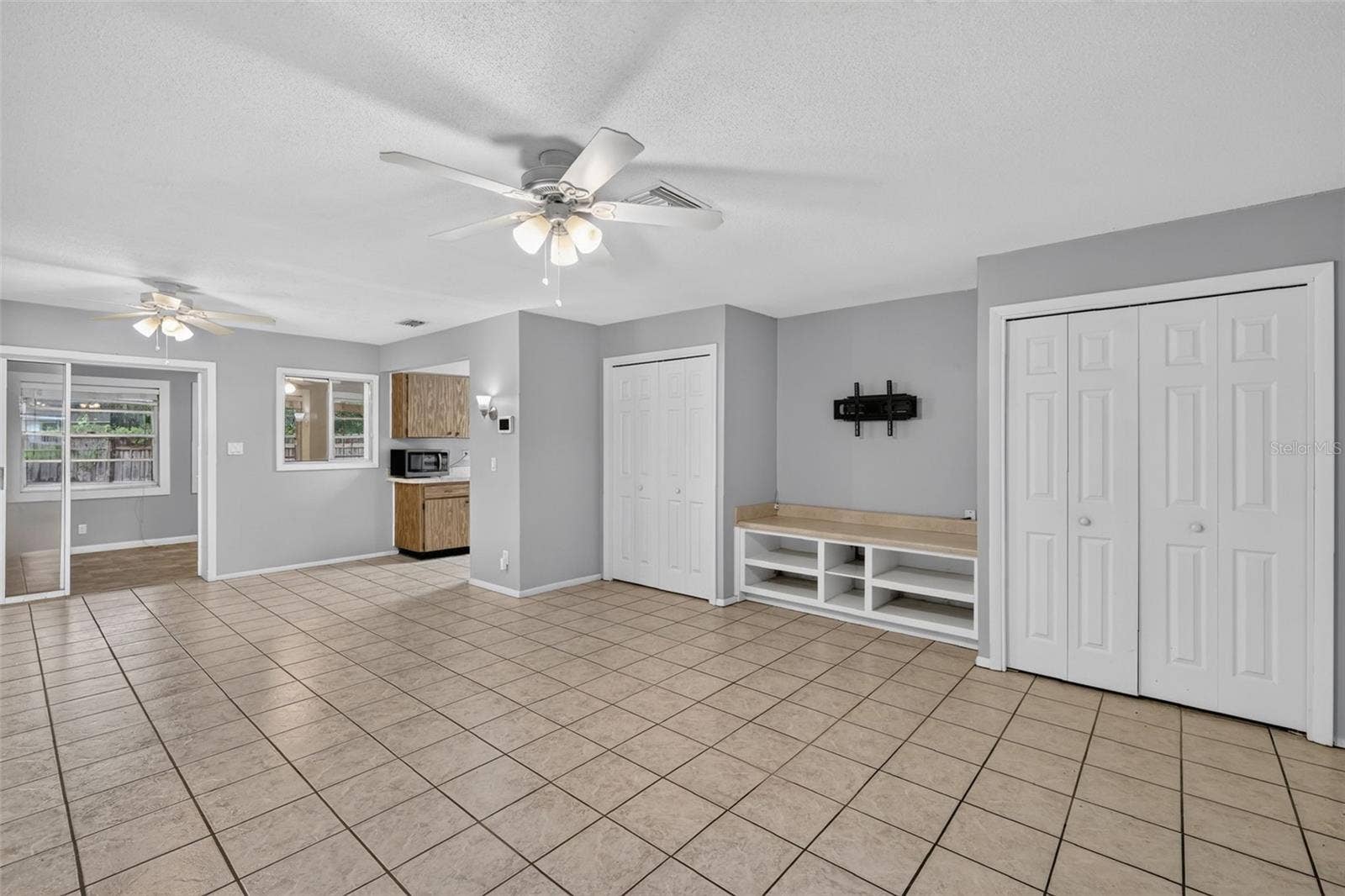 1305 ORANGE AVENUE, Tavares, FL 32778 Open Living Space With Easy Flow Into The Kitchen and Florida Room