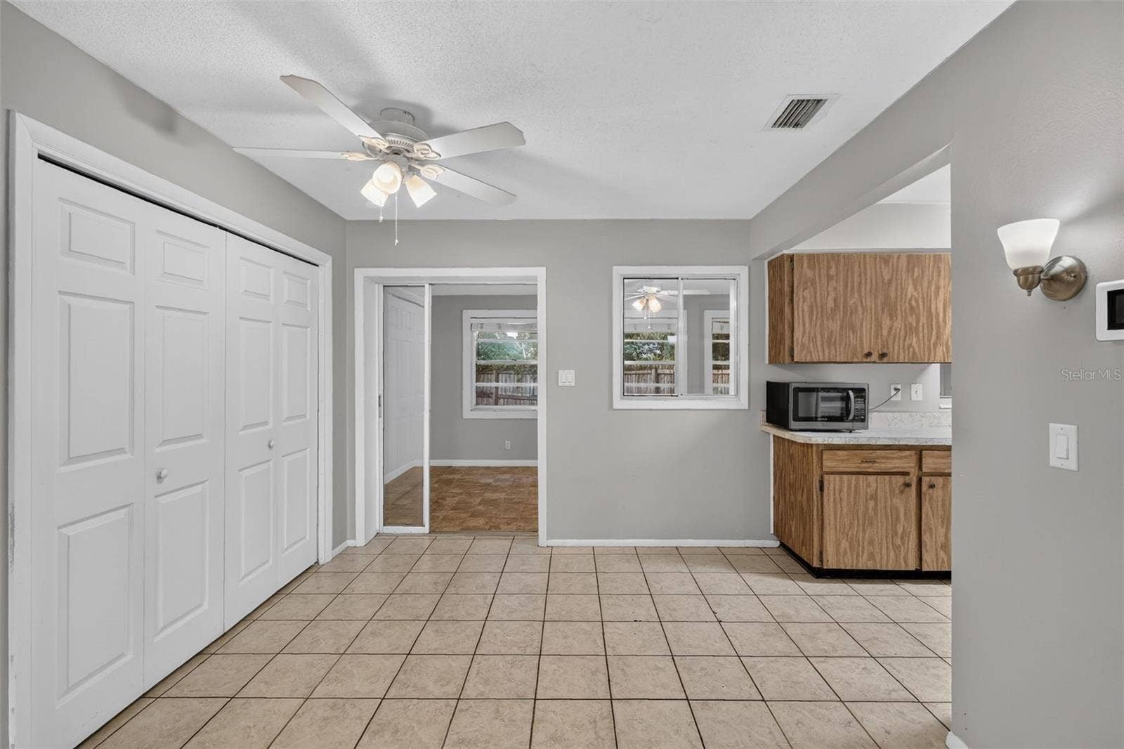 1305 ORANGE AVENUE, Tavares, FL 32778 Living and Kitchen Areas Connect Easily for Everyday Living