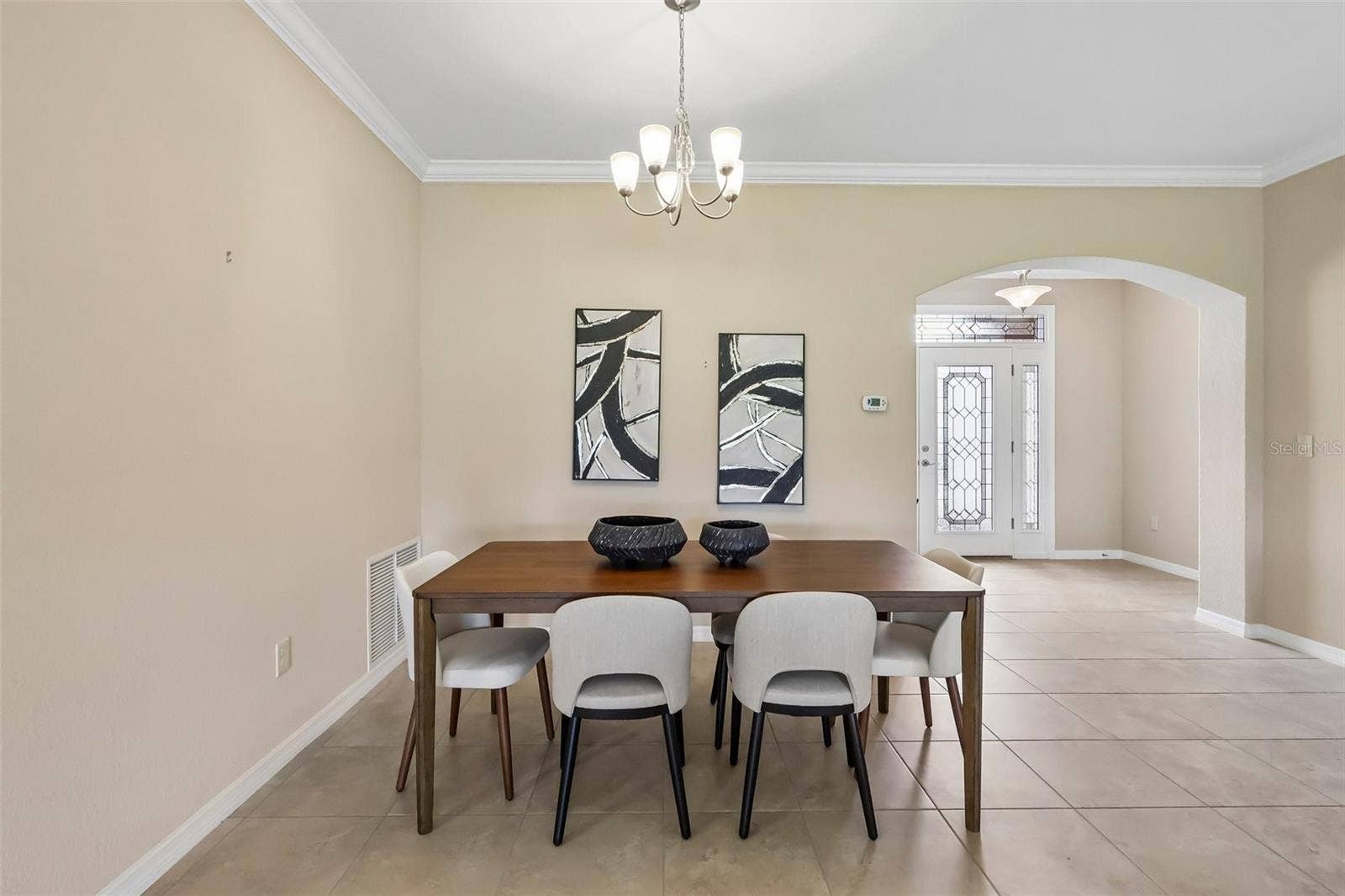 Foyer opens to the living and dining areas.
