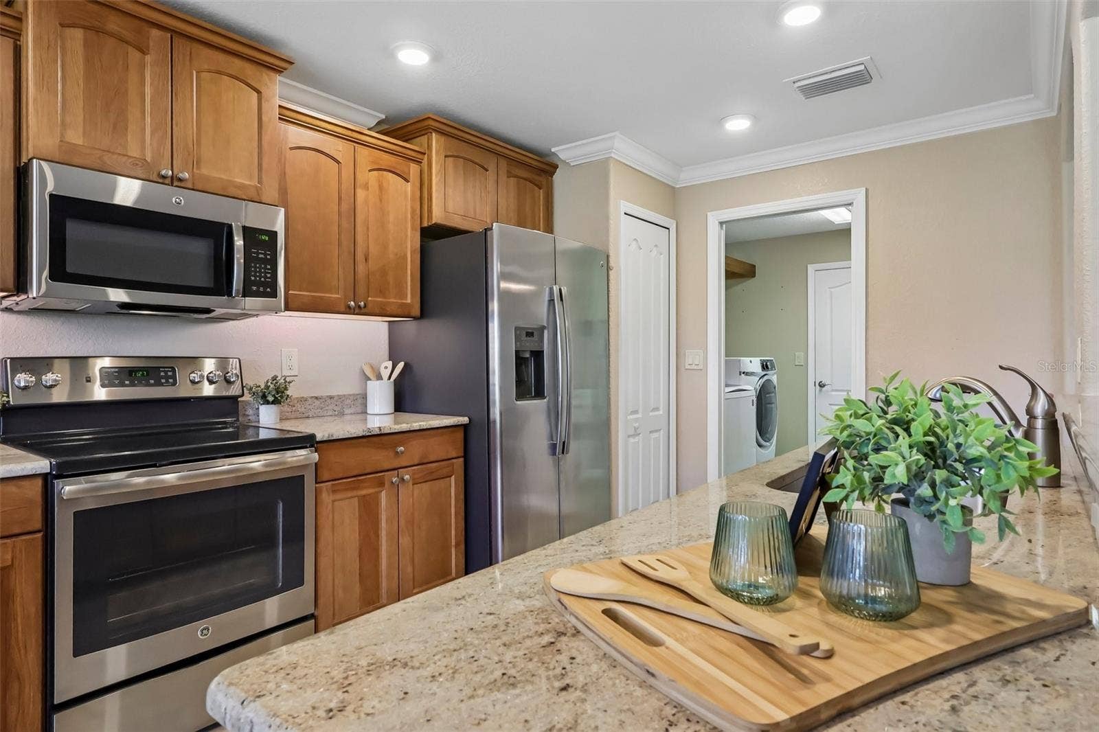 Quartz counters and stainless steel appliances.