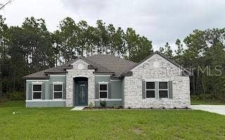 5017 N PEPPERMINT DRIVE, Beverly Hills, FL 34465 Stunning Exterior w/Stone Accent, Side-Facing 3-Car Garage