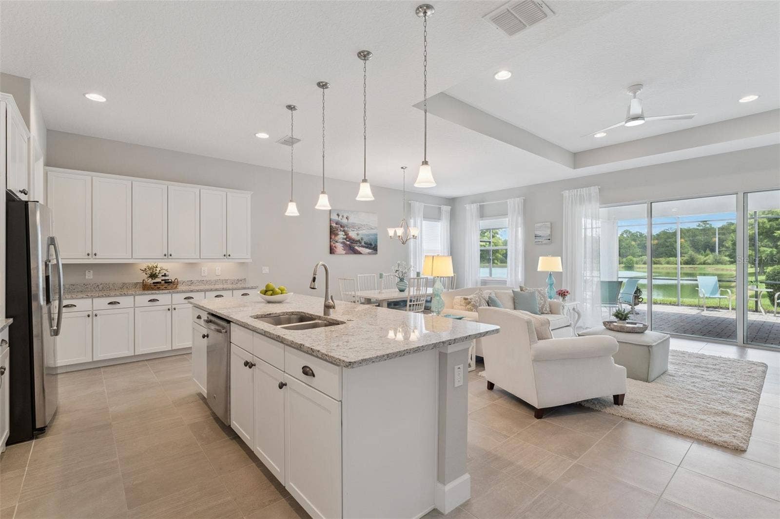 19' x 10' Kitchen w/ pendant lighting, granite countertops & 42" wood cabinets