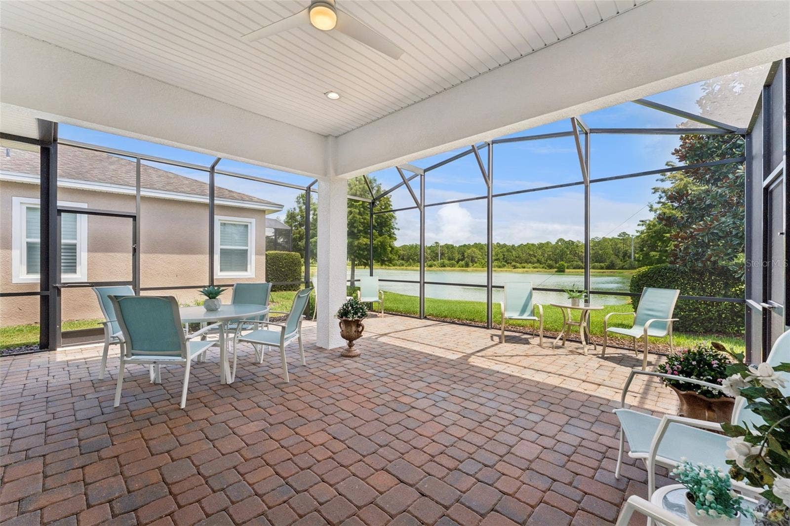 23' x 22' Screen enclosed covered lanai w/ a fabulous Pond view