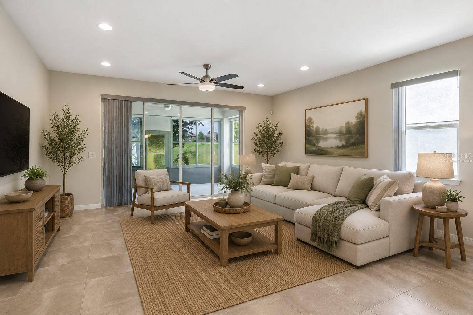 2368 OXMOOR DRIVE, Deland, FL 32724 Virtually Staged living room with expansive stackable sliders adding to your living space.
