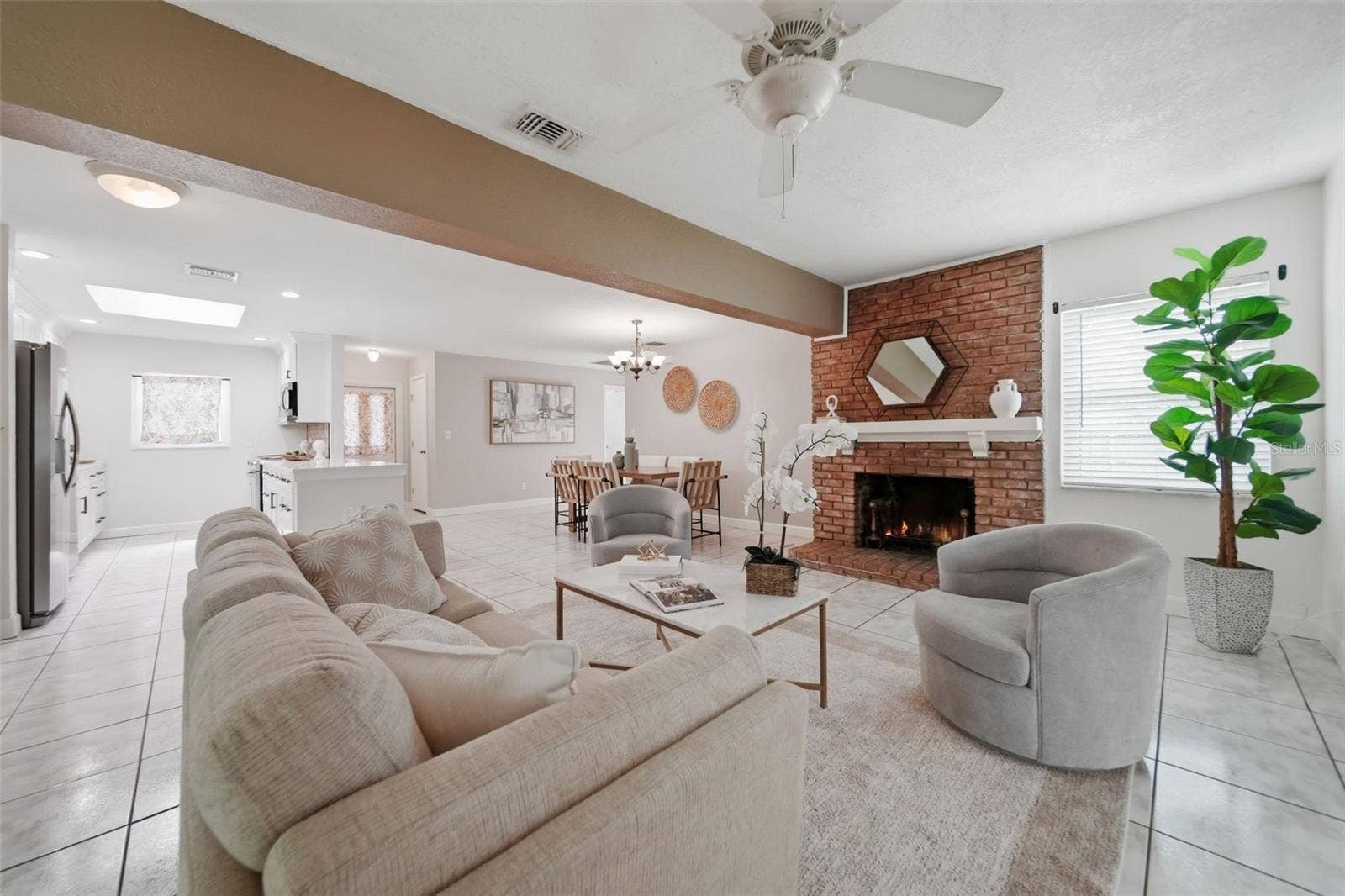1540 E HORATIO AVENUE, Maitland, FL 32751 Living room space with fireplace.