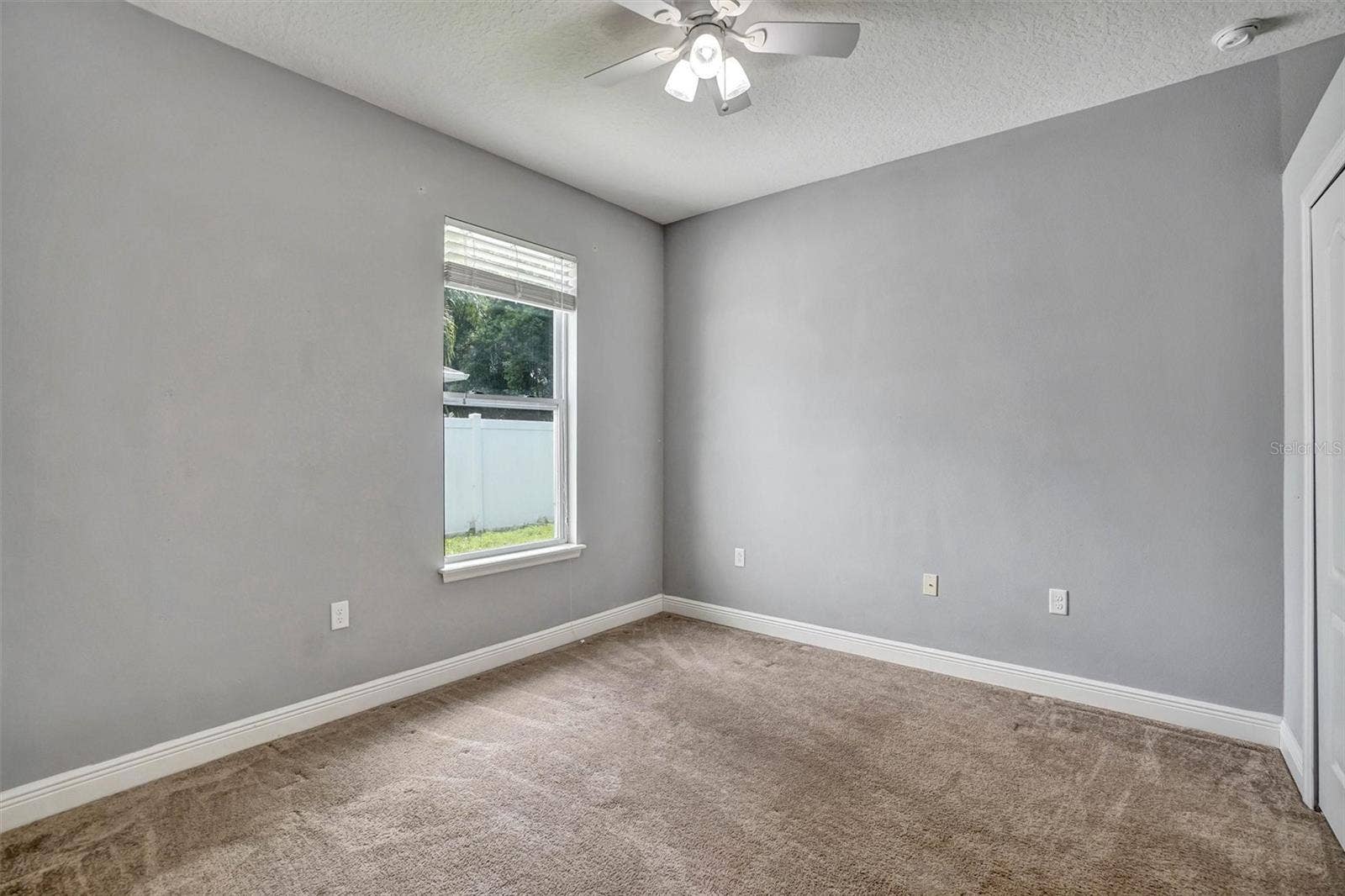 Fourth BedroomSpacious fourth bedroom with a neutral interior and plenty of room for furnishings.