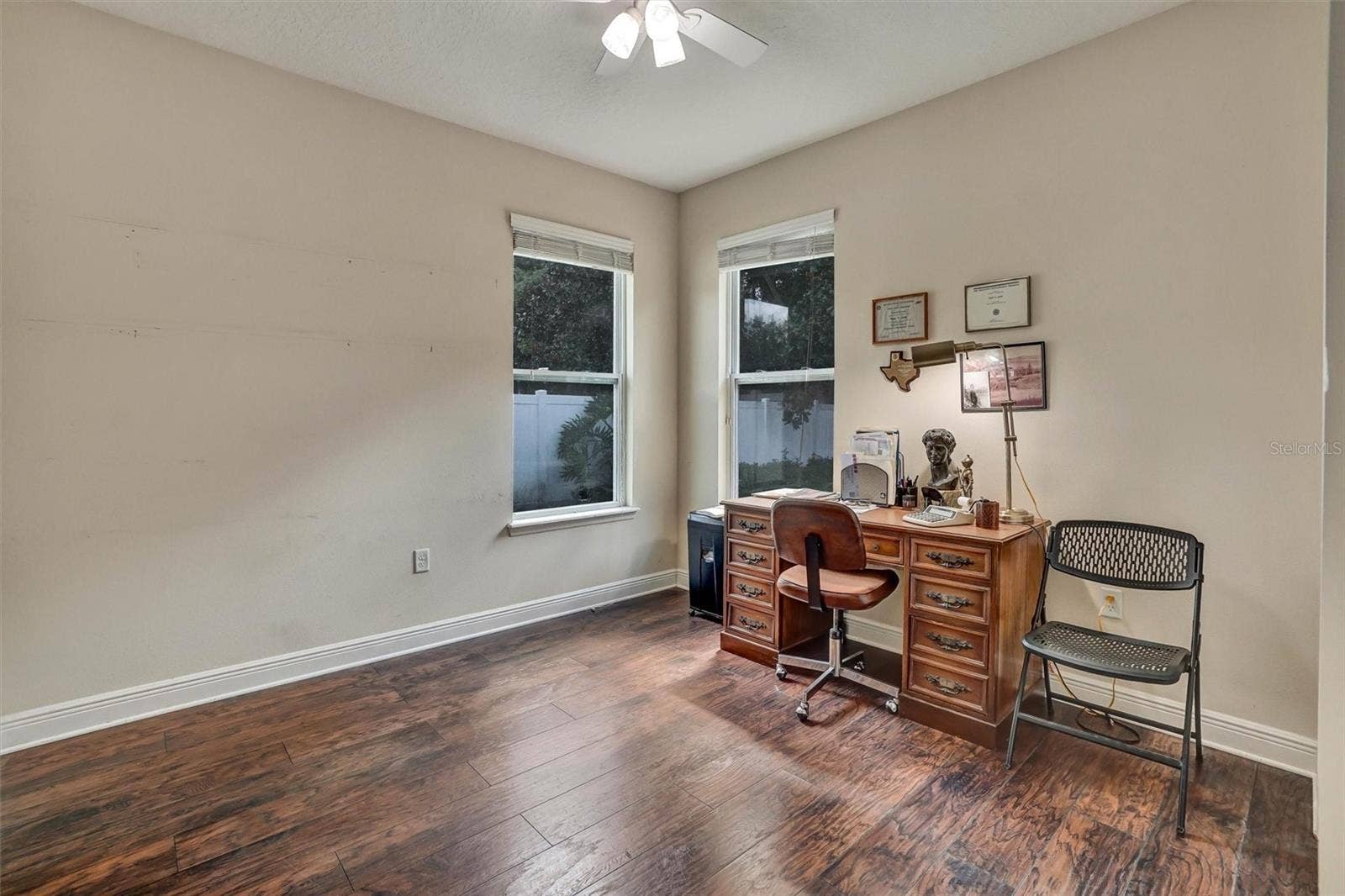Third BedroomSpacious third bedroom with wood-look flooring, ceiling fan.