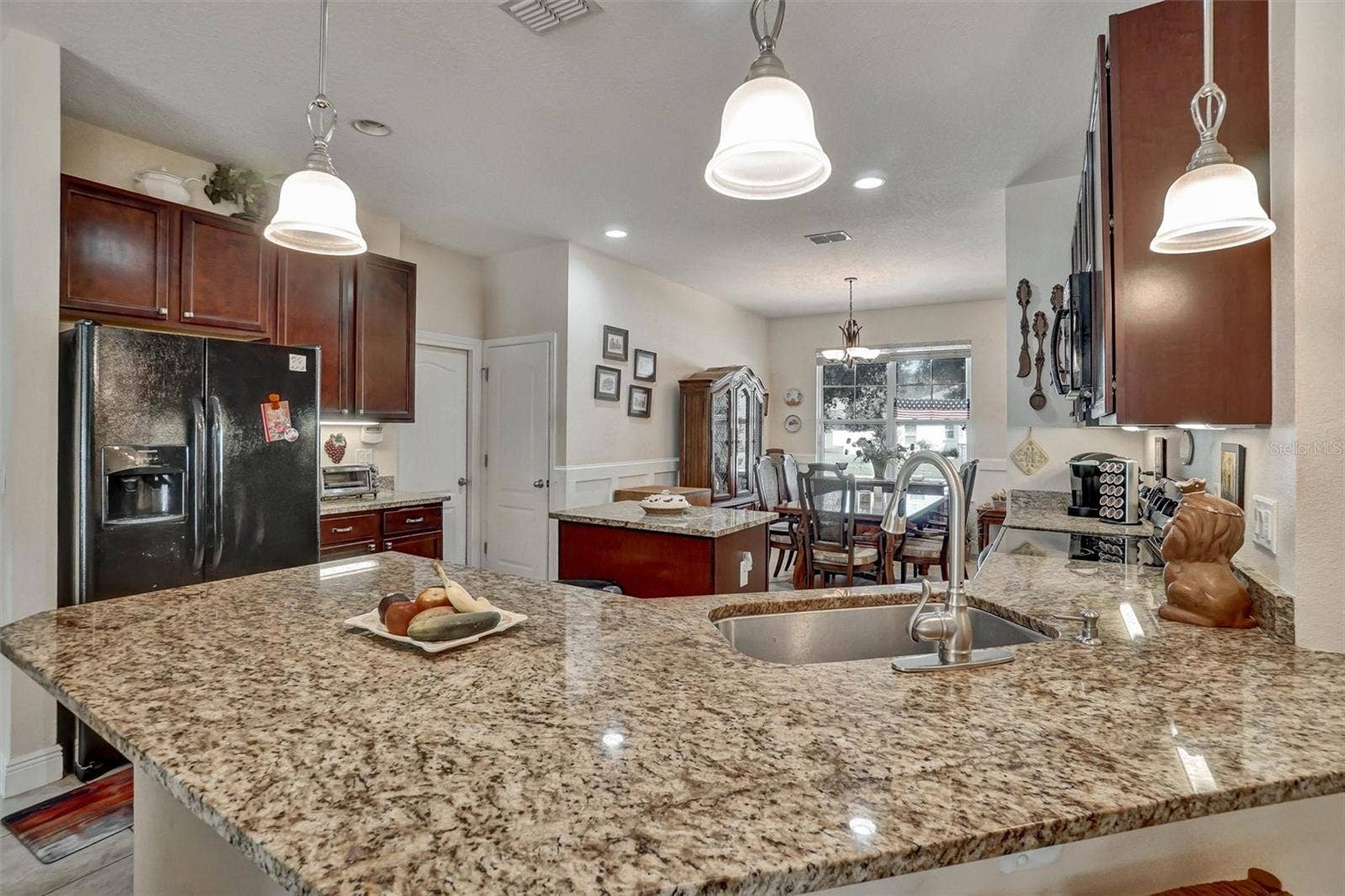 Kitchen CountertopLarge granite countertop provides generous workspace and overlooks the dining area.