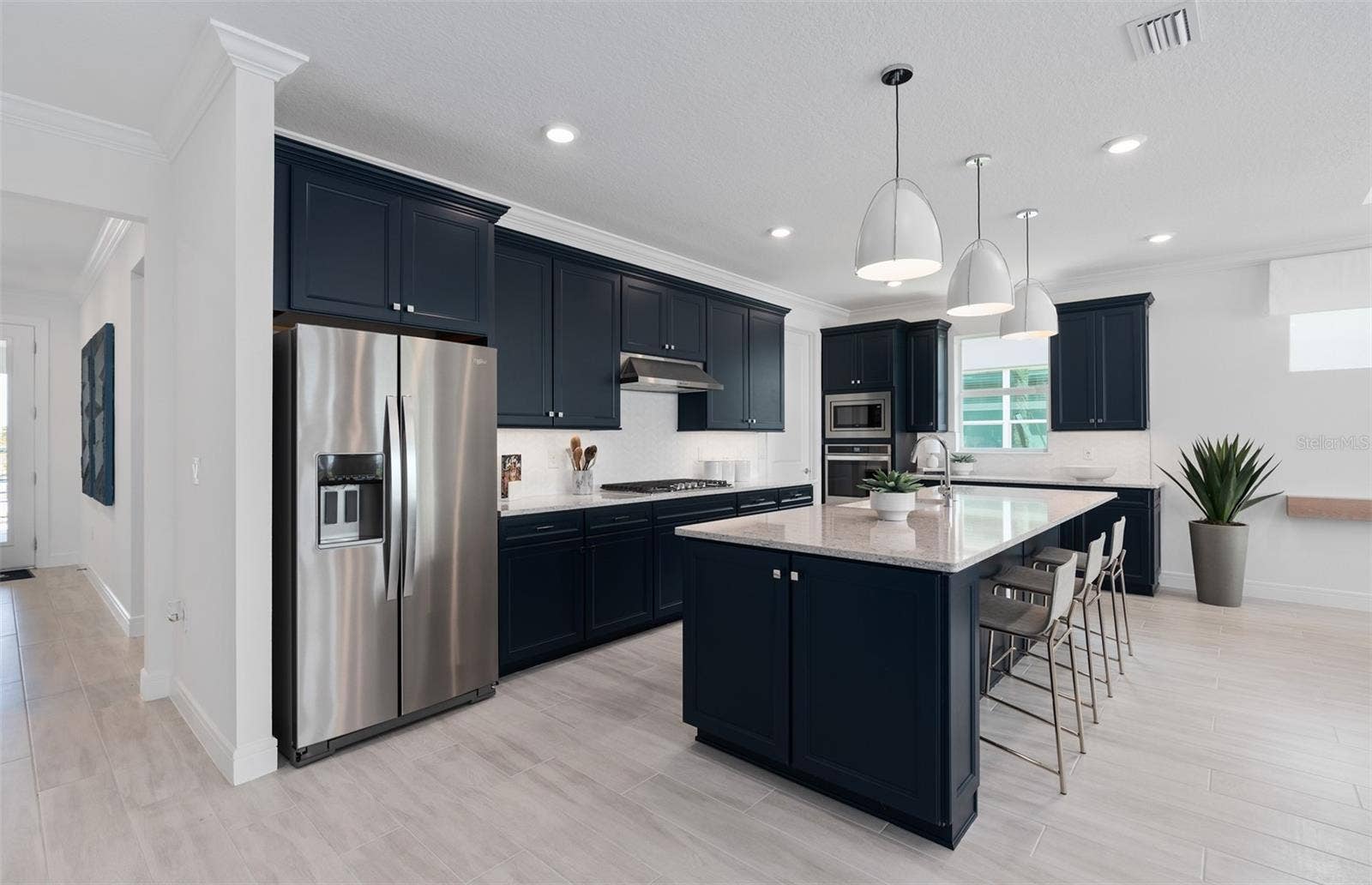 1313 ZESTY CITRUS LANE, Minneola, FL 34715 Model Home Design Only. Pictures and furnishings are for illustrative purposes only. Elevations, colors and options may vary. Furniture is for model home staging only.