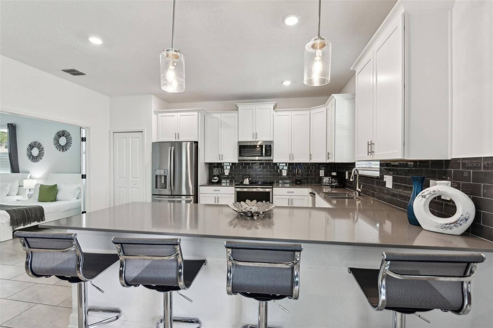 9266 SOMMERSET HILLS DRIVE, Davenport, FL 33896 Open kitchen with bar seating