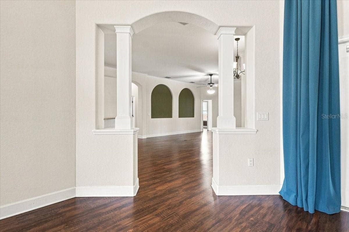 230 LAKE ARIETTA COURT, Auburndale, FL 33823 opening from living room to kitchen and family room
