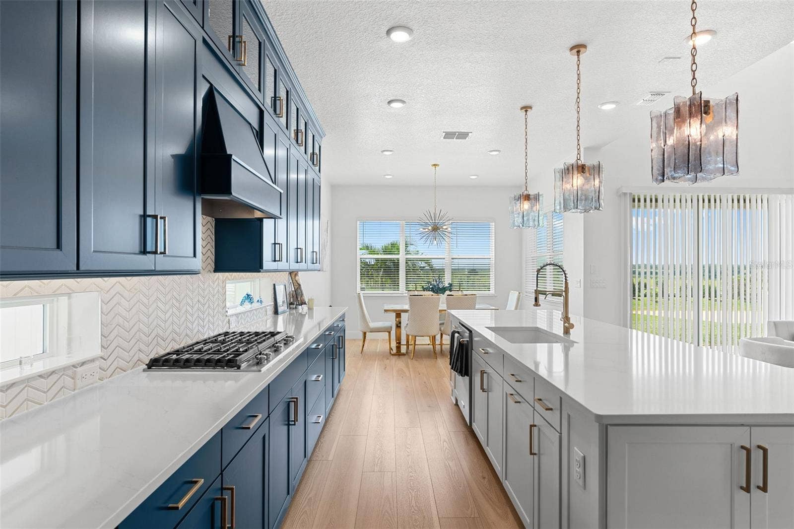 4617 GOLDEN BIRCH AVENUE, Clermont, FL 34714 Kitchen is open to a casual dining space and the generous living room.