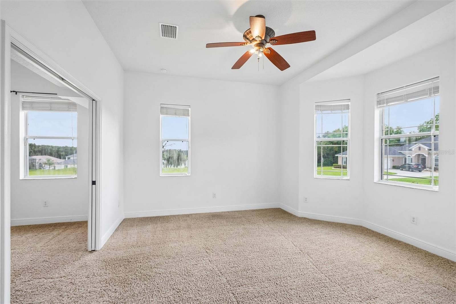 1113 MYRTLE BREEZES CT, Fruitland Park, FL 34731 4th bedroom with pocket door open