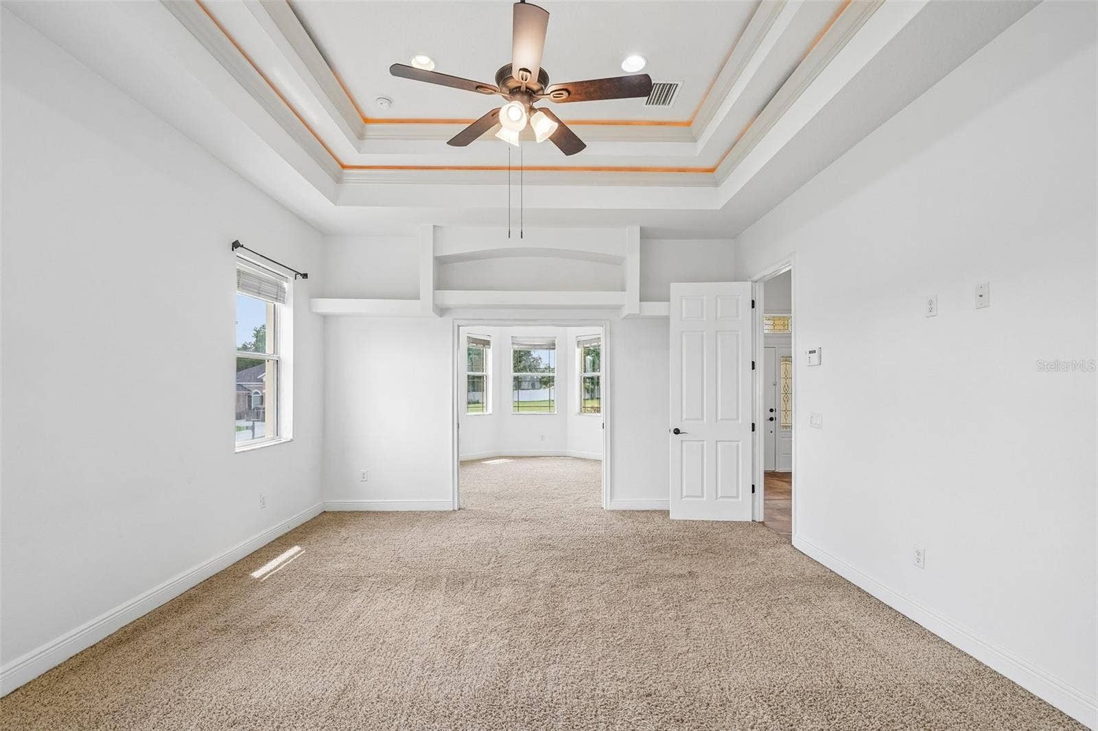 1113 MYRTLE BREEZES CT, Fruitland Park, FL 34731 Master Bedroom with pocket door open