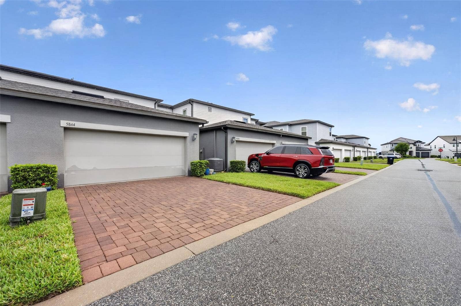Rear Garage with private pavered driveway